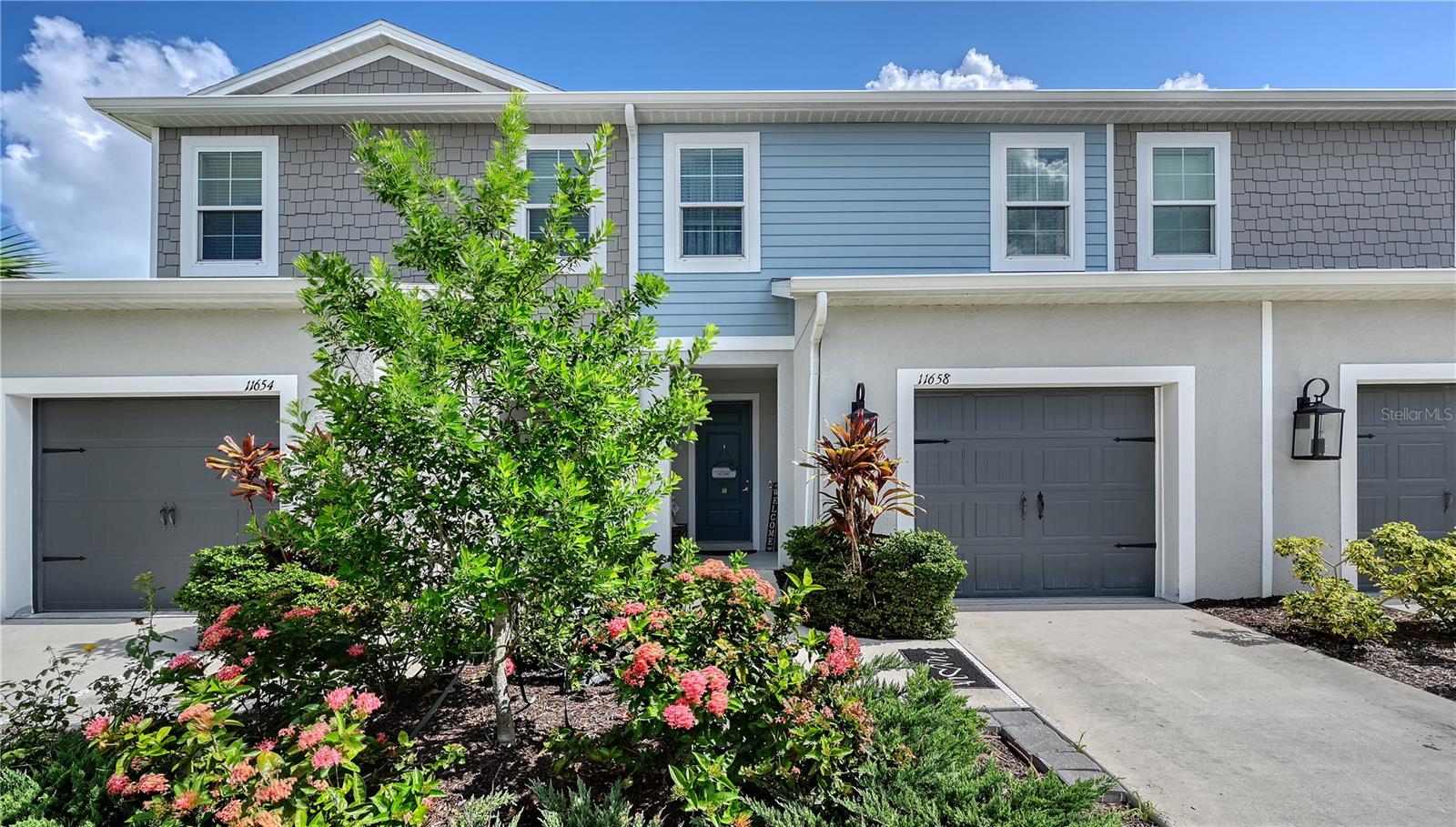 Nestled within the thriving North River Ranch community of Parrish, this elegant 3-bedroom, 2.5-bathroom townhome offers a harmonious blend of style, comfort, modern convenience and comfort with over1800 square feet of living space. Positioned at the end of a quiet cul-de-sac and overlooking a tranquil pond, the residence boasts serene water views and sophisticated design elements throughout. Once inside you will discover a beautifully appointed interior featuring brand-new carpeting, refined tile flooring, recessed lighting, and designer crystal ceiling fans. The gourmet kitchen is a culinary delight, showcasing newly upgraded stone countertops, a stylish tile backsplash, stainless steel appliances, and an expansive walk-in pantry.
Upstairs, a spacious loft provides the perfect setting for a home office, media room, or additional lounge space, complemented by a large storage closet. The luxurious primary suite offers two generous walk-in closets and a sleek, spa-inspired walk-in shower. Additional highlights include Bluetooth-enabled smart home features, a screened-in lanai ideal for peaceful mornings by the water, and an epoxy-finished garage and front entry for added flair.
Located within a secure gated community, residents enjoy access to resort-style amenities including a clubhouse, fitness center, sparkling pool, dog park, playground, and scenic walking and biking trails. North River Ranch is one of Parrish’s most sought-after master-planned neighborhoods, known for its rapid growth, family-friendly atmosphere, and top-rated schools. This is a rare opportunity to own a low-maintenance home in a flourishing location—schedule your private tour today.