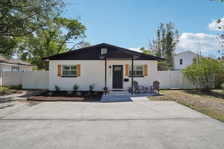 Welcome to this stunningly renovated, move-in-ready gem in the heart of Tampa Heights. Blending modern sophistication with cozy bungalow vibes, this 5-bedroom, 3-bathroom home at 3007 N Woodrow Ave offers an expansive, open-concept floor plan designed for effortless entertaining and comfortable living.  Brand new standing seam METAL ROOF (April 2025)!

The heart of the home is a chef-inspired kitchen featuring dramatic exotic stone countertops, professional-grade stainless steel appliances, and sleek shaker cabinetry that flows seamlessly into the light-filled living area. Natural light pours in through a custom skylight and oversized windows, highlighting the maintenance-free large-format tile flooring that spans the main living spaces.

The primary suite serves as a true sanctuary, complete with a private sliding glass entry to the backyard and a spa-like ensuite bathroom. Indulge in the blissful freestanding soaking tub, or enjoy the convenience of a dual vanity and a massive walk-in shower with high-end matte black fixtures. Outside, the fully fenced-in yard provides a private oasis, perfect for weekend BBQs or enjoying the Florida sunshine. Located just minutes (.7 miles) from the vibrant Armature Works, the Riverwalk, and Downtown Tampa.  Super convenient to Publix, Sprouts, Tampa International, so this home places you right in the center of the city's most sought-after dining and entertainment. Don't miss your chance to own a piece of the Heights!