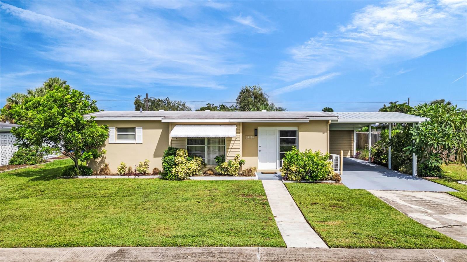 Welcome Home! Discover this charming 2-bedroom, 1-bath home offering 995 sq. ft. of comfortable living space with a spacious 14x30 carport. Step inside to find classic terrazzo flooring in the living room, dinette, and primary bedroom, with durable tile throughout the kitchen, guest bedroom, and bath. The kitchen is fully equipped with a stove, refrigerator, dishwasher, and microwave, plus additional cabinetry in the dining area that makes the perfect coffee bar. The primary bedroom features a large walk-in closet, while custom barn doors lead you into the roomy guest bedroom. The bathroom includes a shower/tub combo and single-sink vanity. Enjoy the convenience of an inside laundry room with washer and dryer included. Outside, a 10x10 shed with electric provides ideal space for storage, a workshop, or hobbies. The home is beautifully landscaped and connected to city water and sewer. Recent updates include: 2025: Interior paint & new side entry door, 2024: Carport replaced, 2021: Roof, 2018: AC mini split. With NO HOA, NO deed restrictions, and NO flood zone, this home is perfect for first-time buyers, downsizing, or investors. Located in a quiet neighborhood yet close to restaurants, shopping, beaches, and more — this move-in ready home is a must-see! Schedule your appointment today and make it yours!