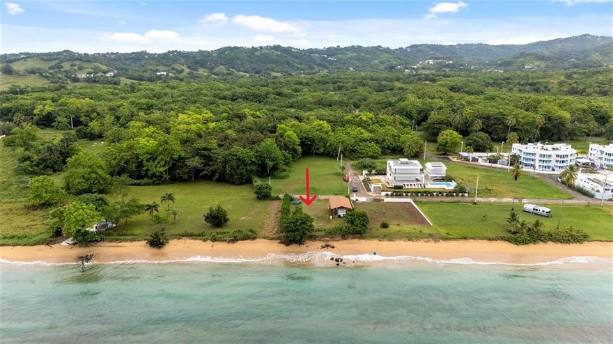 Don't miss out on this opportunity to own a beautiful ocean front lot located on the south side of Rincón.  The lot is completely flat and is fenced on three sides.  On the ocean side there is a retaining wall buried in the ground for security and to prevent erosion.  This side is also bordered with plants.  There is a shade tree on the premises. Present is a wooden shelter that houses a trailer/camper that can be negotiated.  The lot is perfect for building your dream house where you can enjoy the ocean breezes, take a dip in the warm, carribean waters or enjoy long walks on the sandy beach.  It is also an opportuniity for investment potential.   Property taxes are $85.00/year.  Electriccity and water on the road.  Coordinates: 18.314, -67.243  Call for a showing today!  Asking $799,000.00.  Some restrictions apply.