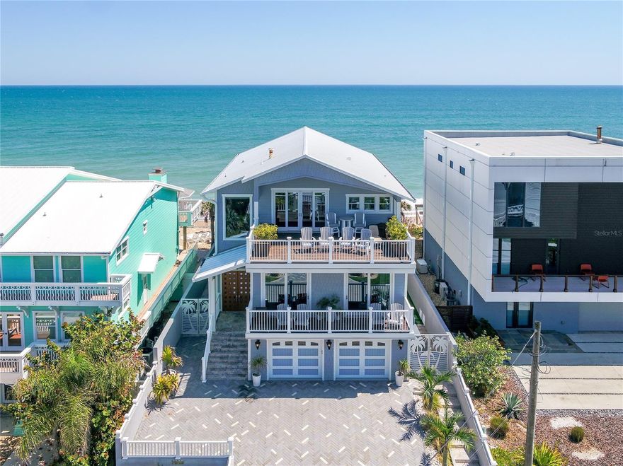 THE RETREAT OF A LIFETIME. From the river to the sea, an inheritable estate in beloved NSB for the most discerning of buyers. A tri-parcel, one-of-a-kind home, comes fully renovated and ***FURNISHED*** for your dream getaway at the beach. Thoughtfulness and detail make this not only ergonomic, but seamless at every turn. RH chandeliers illuminate the living spaces along with a custom Lutron lighting and Sonos sound systems for creating the perfect ambiance. Anderson impact windows and hideaway sliders frame your views, complemented by remote blinds and curtains for privacy and efficiency. RELAX in your oceanfront oasis to include a heated and jetted custom pool with IPÉ decking and a grandfathered gazebo overlooking the commanding surf. Luxury gathering kitchen featuring dual kitchen islands, Sub-Zero refrigerator's and drawers, WOLF gas stove, double silent dishwashers, and honed marble slab countertops and backsplash. Everything has been meticulously thought out, nothing overlooked. Showstopper owner suite with East & West decks for sunrise to sunset penthouse vistas- *ask about the surprise feature. Luxury spa-like bathroom with marble slab shower, as well as a freestanding soaking tub. Custom cabinetry and Italian imported 9" plank hardwood flooring throughout the home. Fully equipped gym, impressive 6 panel theatre, and custom wet bar. Watch the dolphins play or take the kayaks (included) for an afternoon paddle from your COVERED RIVERFRONT boat slip + dock. Packed with intrinsic value- Luxury awaits! ***SEE EXPANDED FEATURES LIST*** Qualifications required prior to tour. ;Water: City