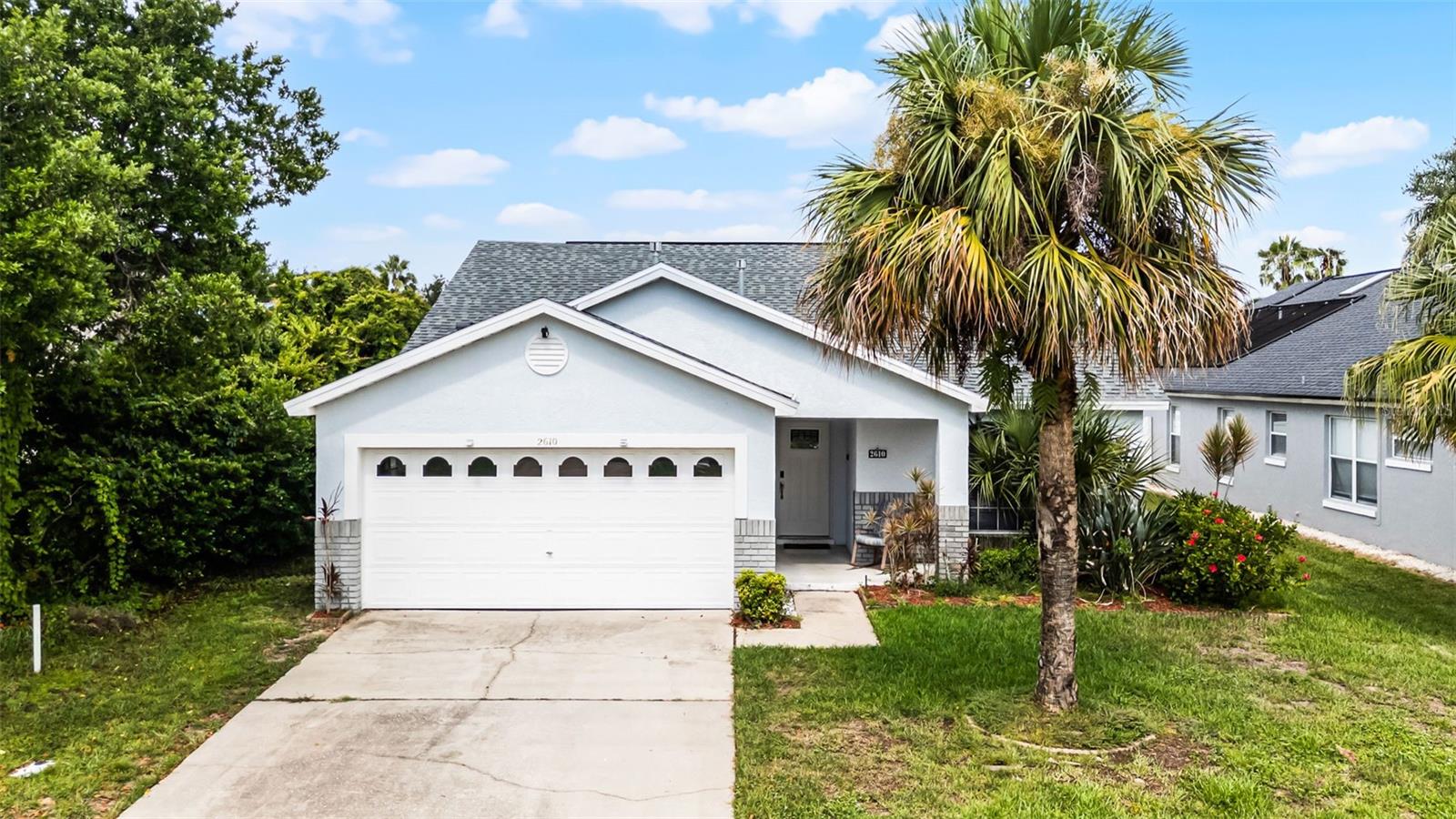 Looking to invest in an active, income producing AirBnB? Look no further than this TOP PRODUCING turnkey vacation rental. With a 4.97 star rating and “Super Host” status, this home has potential to secure more bookings and generate more revenue than before. $43k in bookings in 2024 (with only over 26 weeks occupancy) and already $36k in 2025 showcase the opportunity to double the income. Recently renovated in 2024 with FULL roof replacement, new HVAC, new hot water heater, updated appliances, refinished cabinets, freshly painted bedrooms/bathrooms, updated bedroom flooring, and updated fixtures. This home boasts 4 bedrooms including 2 theme rooms (Star Wars and Minions), 2 bathrooms, 2 car garage, and a private, heated, salt water pool. Primary bedroom is equipped with an ensuite bathroom with direct access to the pool, walk-in closet for guests and an additional locked owner’s closet within. This home has all the features desired for a vacation rental/second home including security camera, smart locks, wifi thermostat, landscapers, pool maintenance, and cleaning service already in place. Prime location to Disney parks, Margaritaville, shopping, dining, golf courses, and so much more!