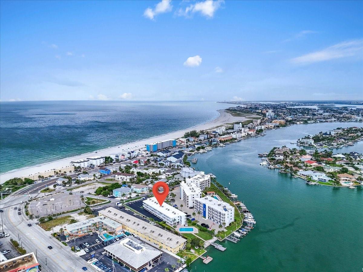 Step into this completely renovated and fully furnished 1-bedroom, 1-bath condo just steps from world-famous Sunset Beach. Designed with style and comfort in mind, this beachside gem features high-end stainless steel appliances, elegant quartz countertops, and a designer bathroom with stunning custom tilework. The open-concept layout leads to a private balcony where you can enjoy warm Gulf breezes and tranquil vibes.
Tucked between the Gulf and Intracoastal, the community offers a sparkling pool, dock access, laundry facilities, and available covered parking. All utilities are included except electric. With walkable access to beach bars, dining, and live music, and just minutes to downtown St. Pete and John's Pass, this turnkey retreat delivers the best of Treasure Island living.