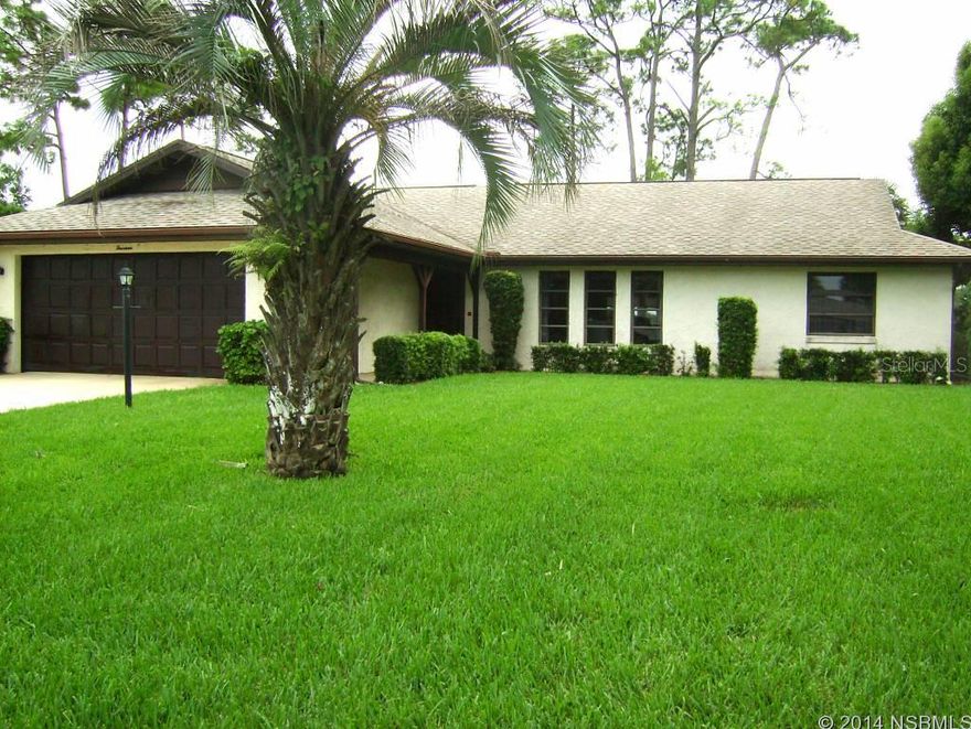 Beautiful Home Sitting Right on the New Smyrna Beach Golf Course! This home shows the pride of ownership. It is a 3B/2B split plan offering a very open floor plan. 2184 sq. ft. under air, vaulted ceilings (with beams) in living room, dining room & family room. Concrete block home with stucco. Family room off the rear of home offers panoramic views of the fairways and greens.  Don't miss this beauty! ;Water: City