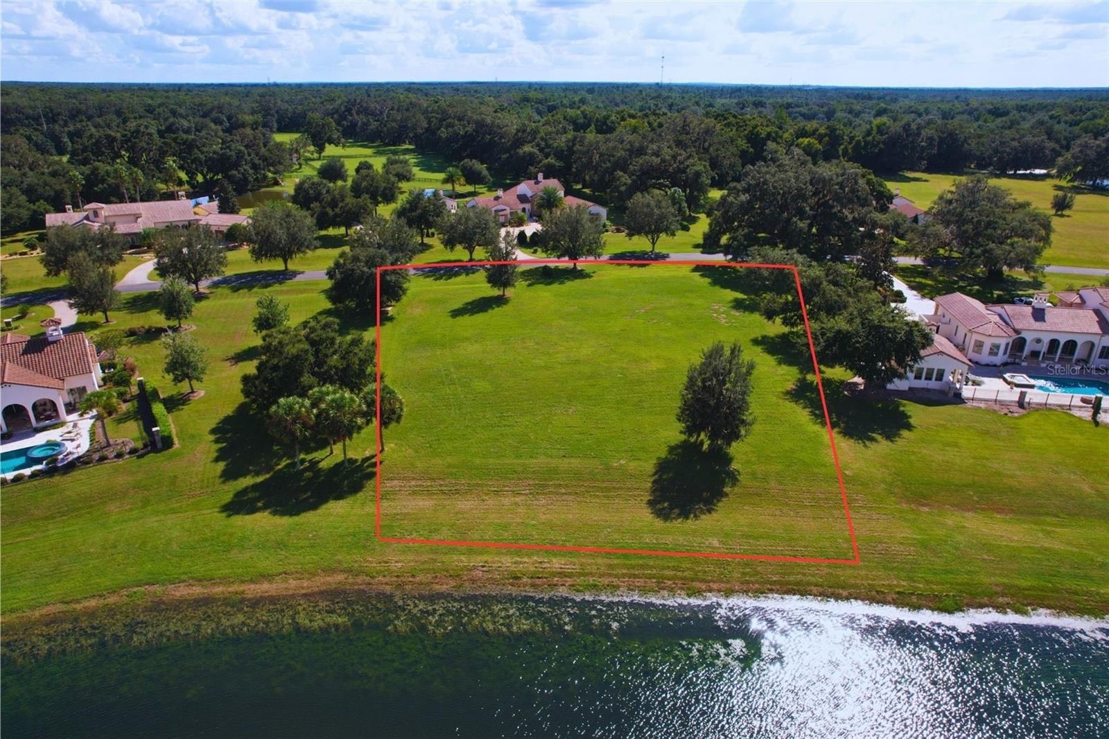 Build the Tuscan-style home of your dreams on this picturesque 1.43-acre lakefront parcel in the gated community of Bel-Lago. Located in Bel-Lago's South Hamlet, this parcel features unobstructed views and frontage to the community feature lake, oak trees, and a buildable house pad for construction. One of the last available vacant lots in the South Hamlet! Use the community builder, or bring your approved external builder to construct your perfect Tuscan-style home (minimum 3,000 sqft. living space required). Bel-Lago is an exclusive lakefront and equestrian community uniquely surrounded by over 8,000+ acres of preservation. The community includes a gatehouse, multiple feature lakes, a multi-use internal trail system, and HOA. Enjoy your private oasis in Ocala horse country, while being minutes away from restaurants, grocery stores, and hospitals, 25 minutes to WEC, and only 1.5 hours away from Orlando and Tampa. Call today for more information!