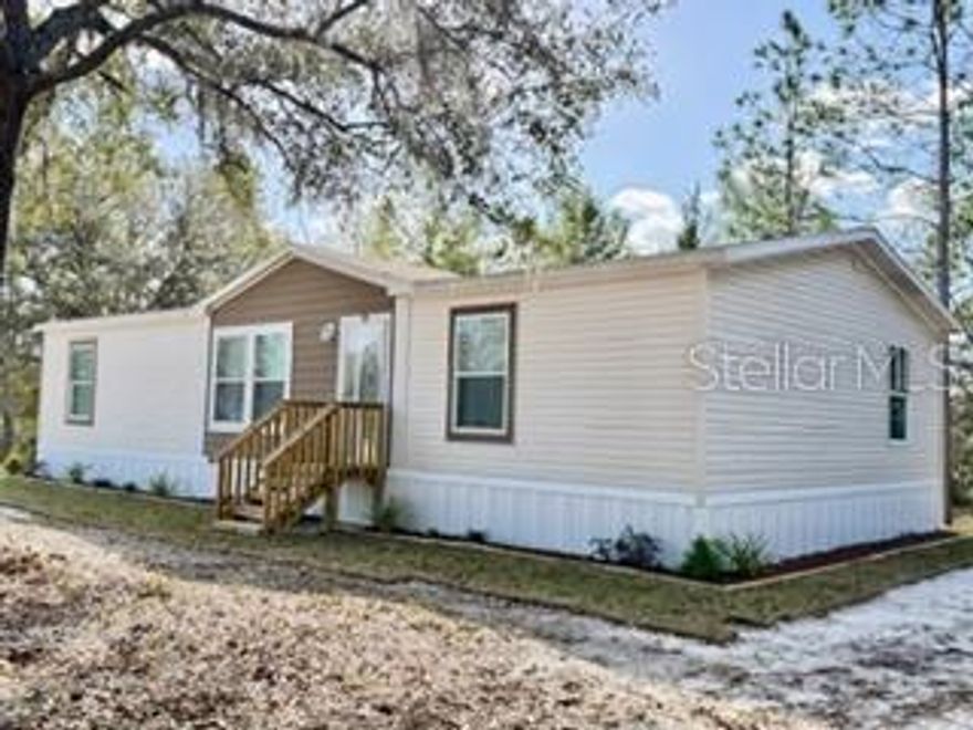 This 2017 3-bedroom, 2-bath Townhome sits on a beautiful one-acre lot with mature trees, offering both space and privacy. The kitchen features an island, a large pantry, and abundant cabinetry—perfect for cooking and entertaining. The dining area opens to the outdoors through sliding glass doors, creating an easy flow for indoor-outdoor living. The spacious primary suite includes a private bath with a garden tub, separate shower, and large vanity with dual sinks. Additional bedrooms are nicely sized, making this home ideal for families or guests. The property is conveniently located just minutes from the town of Bell, with grade A schools, and shopping. With easy access from a nearby paved road, this property combines peaceful country living with everyday convenience. Call to schedule your tour of this property !