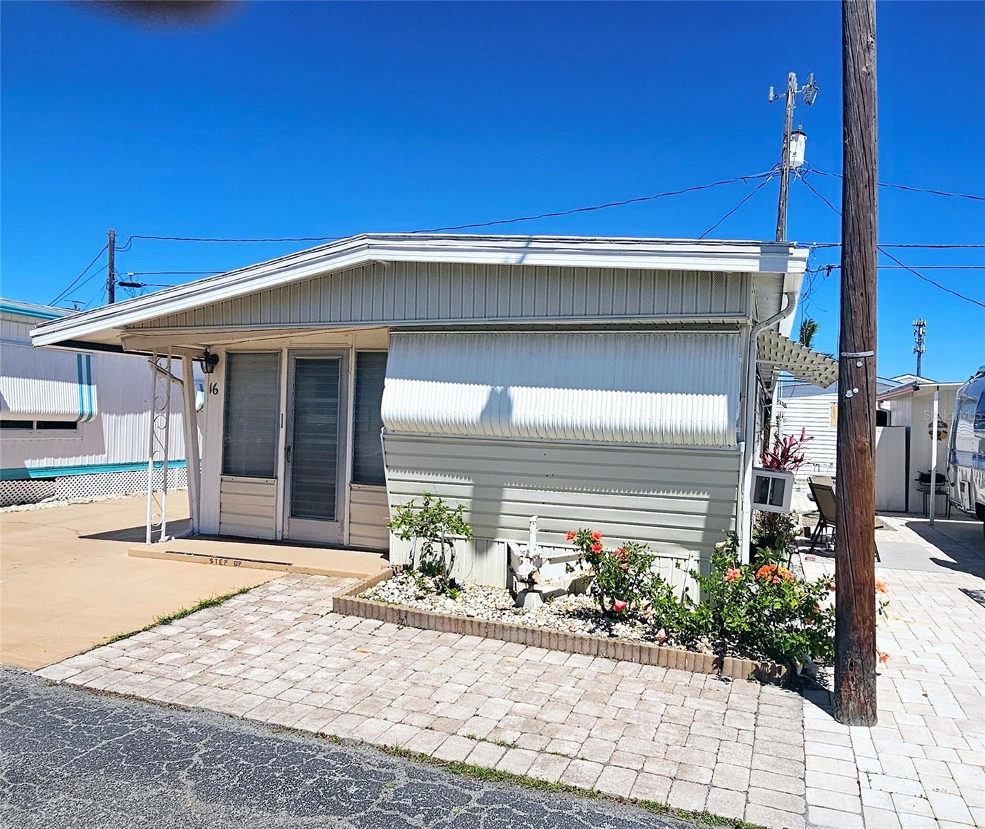Affordable 1BR/1BA Mobile Home in Paradise Bay Estates – Priced to Sell! Looking for a slice of paradise at an unbeatable price? This 1BR/1BA mobile home in Paradise Bay Estates is your chance to own in a prime location near Sarasota Bay and just 2 miles from Anna Maria Island! While the home has some interior storm damage from Hurricane Helene (Sept 2024)—with some remediation already started—this is a fantastic fixer-upper opportunity for the right buyer. ? Features Include: Large carport with 2 sheds & concrete pad (fits 2 cars), Bright & sunny breakfast room/dining area, 1 bedroom + bonus room (ideal for office, sewing room, or guest space—just add a Murphy bed or sleeper sofa, Active 55+ community with endless social activities and resort-style amenities: Heated pool, hot tub, pickleball, shuffleboard, waterside events & more! Low HOA of $180/month (includes water, sewer, trash & lawn care!) With some TLC, this home can shine again! Don’t miss your chance to buy into this highly sought-after community at a bargain price. Call today for details or to schedule a showing!