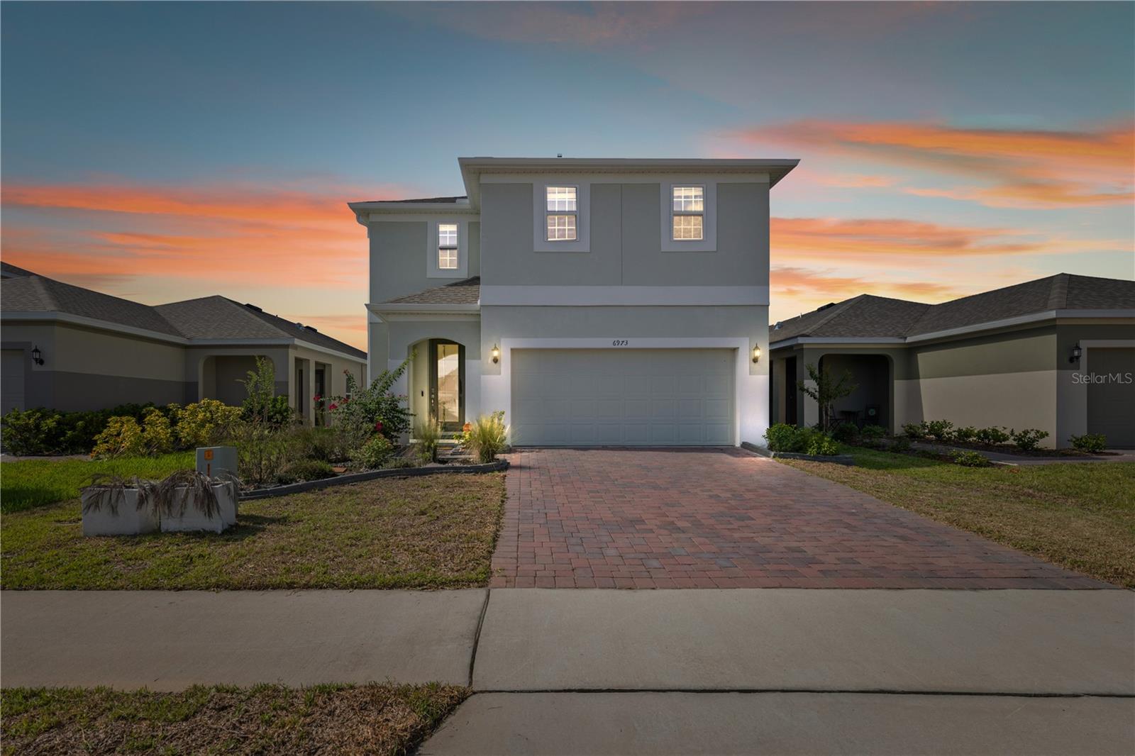 Built in 2023, this stunning two-story home offers 4 bedrooms and 2.5 bathrooms, with the primary suite conveniently located on the first floor. The open-concept layout downstairs seamlessly connects the living and dining areas, creating a bright and inviting space for entertaining and everyday living. Upstairs, you’ll find a spacious family room, a large laundry room, an additional linen closet, and a coat closet, providing plenty of storage and flexibility for your lifestyle. The thoughtfully designed guest bathroom includes a private shower/toilet closet with its own door—perfect for allowing multiple people to use the space while maintaining privacy. Situated in an up-and-coming neighborhood with easy access to both Turnpike North and South entrances, this community offers a resort-style pool, a clubhouse gym, and multiple parks. Outdoor enthusiasts will enjoy being close to Lake Emma and Lake Lucy, making it easy to enjoy nature and recreation right at your doorstep. Turnpike entrances are within a 10-minute drive and Clermont is accessible within a 20 minute drive.