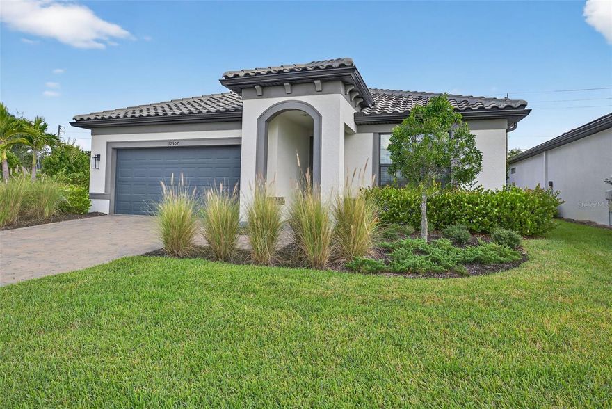 Home Ready Now and NO CDD FEES! 4-bedroom home, ideally situated near Lakewood Ranch and I-75. Built in 2022 and features 4 bedrooms, 2 bathrooms, and 1,850 square feet of thoughtfully designed living space with ample room to add a swimming pool. The open-concept floor plan highlights a chef-inspired kitchen with quartz countertops, subway tile backsplash, stainless steel appliances, and a large center island ideal for entertaining and everyday living. Tile flooring flows throughout the main living areas into a light-filled great room and out to an extended covered lanai overlooking a private backyard retreat. From the front, enjoy peaceful pond views along with a paver driveway, tile roof, and professionally landscaped exterior that create impressive curb appeal. The spacious primary suite offers a walk-in closet and a spa-style bath, while the additional bedrooms provide flexibility for guests, a home office, or a growing household. Additional features include a 2-car garage with EV charger, hurricane shutters, and maintenance-free lawn care. With low HOA fees, no CDD, and convenient access to Lakewood Ranch, I-75, shopping, dining, top-rated schools, and the Gulf Coast beaches, this move-in ready Florida home delivers comfort, convenience, and a highly desirable location.