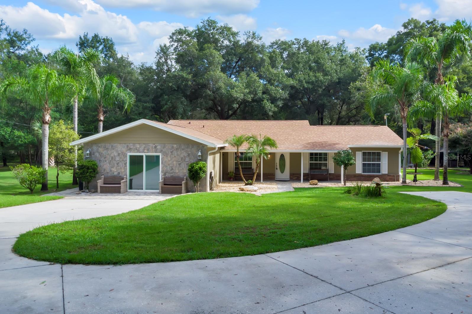 Welcome to 2619 W Ponkan Rd, a stunning home for sale in Apopka! This spacious home offers 4 bedrooms, 3 bathrooms, an open-concept living space. This beautiful home combines functionality with elegant design, featuring an inviting open-concept layout that creates a natural flow between living spaces. The thoughtful design of this home incorporates quality materials and attention to detail throughout. Each room has been carefully planned to maximize comfort and usability with build-in closets, with an emphasis on creating spaces that work for today's lifestyle needs. The practical layout ensures that every square foot serves a purpose, Enjoy the convenience of a private drive with an automatic gate for added privacy. This property is perfect for those seeking seclusion and possibilities; build the house of your dreams, add horse stables, farm or add a commercial nursery. The possibilities are endless!