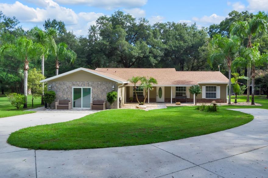 Welcome to 2619 W Ponkan Rd, a stunning home for sale in Apopka!
Price Improvement!!
 This spacious home offers 4 bedrooms, 3 bathrooms, an open-concept living space. This beautiful home combines functionality with elegant design, featuring an inviting open-concept layout that creates a natural flow between living spaces. The thoughtful design of this home incorporates quality materials and attention to detail throughout. Each room has been carefully planned to maximize comfort and usability with build-in closets, with an emphasis on creating spaces that work for today's lifestyle needs. The practical layout ensures that every square foot serves a purpose, Enjoy the convenience of a private drive with an automatic gate for added privacy. This property is perfect for those seeking seclusion and possibilities; build the house of your dreams, add horse stables, farm or add a commercial nursery. The possibilities are endless!