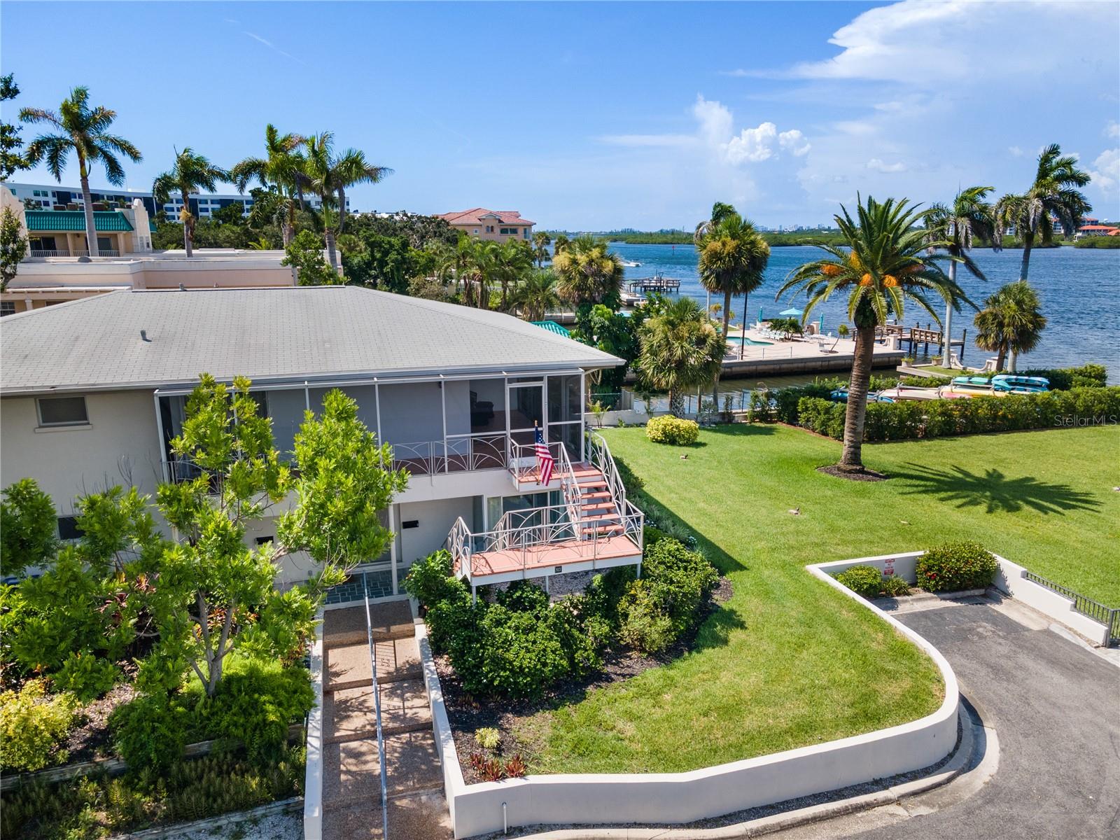 Welcome to Sunrise Porch Lookout — your peaceful intercoastal retreat in the heart of Siesta Key. This bright and tropical second-floor condo is perfectly situated in the highly sought-after Provincial Gardens community, where Old Florida charm meets serene waterfront beauty. Overlooking the intercoastal waterway and lush park-like lawn, the screened-in wraparound porch is your front-row seat to sunrise skies, drifting sailboats, and a cool morning breeze.
This one-bedroom condo offers a king bed, spacious living area, and a small but fully equipped kitchen ideal for light meals or snacks between beach outings. The interior is designed in a cheerful, nautical palette with comfy furniture, modern conveniences, and thoughtful touches throughout. Natural light pours in from windows that frame the stunning water views, creating a welcoming and relaxing space.
Guests of Sunrise Porch Lookout enjoy shared private beach and pool access via neighboring Aloha Kai — just across the street. Relax by the heated pool, explore Siesta Key on foot or by bike, and return to your porch to watch the golden hour settle over the water. With on-site parking, in-unit laundry, and beach gear provided, this getaway is as convenient as it is scenic.
Enjoy direct access to Crescent Beach, kayak the calm waters of the intercoastal, or indulge in local seafood at nearby favorites like Captain Curt’s, Big Water Fish Market, and the original Daiquiri Deck. You're just minutes from Siesta Key Village, Turtle Beach, and even downtown Sarasota via the nearby Stickney Point Bridge.
**Why Guests Love It:**
- Wake up to intercoastal water views every morning
- Peaceful, non-commercialized community with tropical landscaping
- Ideal for couples, snowbirds, and solo travelers looking to relax
- No elevators or crowds — just tranquility and sunshine
Professionally hosted & part of the SV Collection — a handpicked portfolio of unique vacation homes across Siesta Key.
Property Manager has the most updated availability calendar available.
**PLEASE NOTE** Rates vary by week/season. Additional fees and taxes apply. During the months of January, February, and March, there is a 1 month minimum rental period and check-in & check-out dates are only allowed on the first and last day of those months.