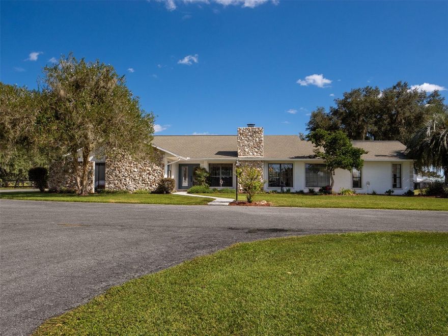 Located just 20 minutes from the World Equestrian Center, this exceptional 20-acre horse farm offers top-tier equestrian amenities and beautiful residential living. The property features a 9-stall concrete block center-aisle barn with 12x12 stalls, including a foaling stall, premium Stable Comfort mats, fans, and a fly spray system. Additional barn features include a hot/cold water wash stall, bathroom, tack and feed rooms, and a eurociser. A separate stallion barn offers two large stalls and a three-bay workshop for equipment storage and additional functionality. Expansive pastures with freshly painted fencing and landscaped grounds surround the farm, creating a serene and scenic setting. The custom-built 3-bedroom, 2-bathroom block home sits at the heart of the property and features an open floor plan, soaring ceilings, a kitchen with new appliances, and a spacious great room with a cozy fireplace. Oversized windows provide panoramic views of the pastures and fill the home with natural light. A charming 1-bedroom, 1-bathroom block guest house completes the property, offering a kitchenette, a laundry room, and a large closet—perfect for guests or farm staff. This farm offers the opportunity to enjoy rural living with professional equestrian facilities in a prime Central Florida location.