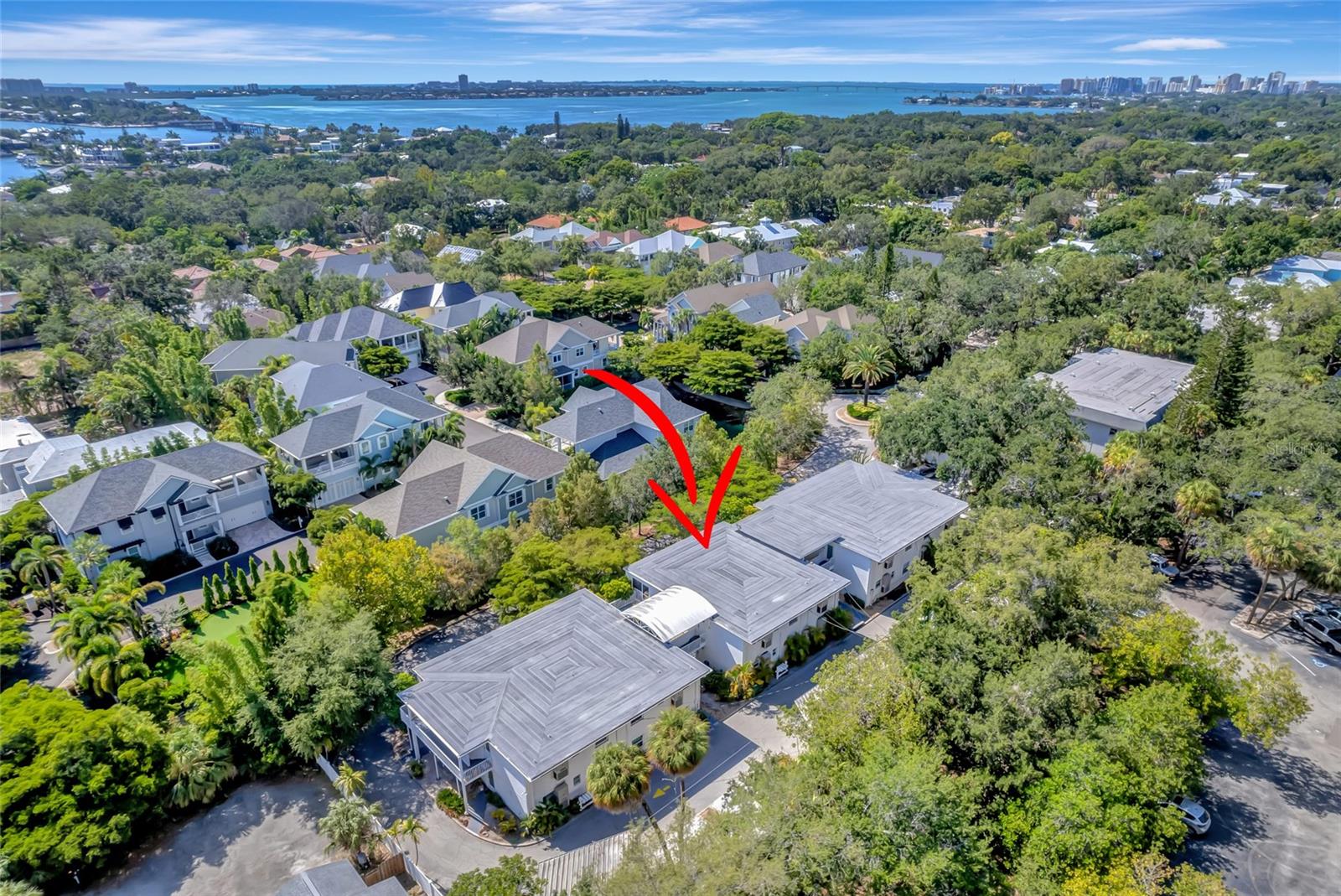 BACK ON THE MARKET!!! Buyer financing fell through. Location, Location, Location! Come see this rarely available hidden gem of a 1-bedroom, 1-bathroom, 2nd floor condo West of the Trail, nestled in a private street in the highly sought after Granada neighborhood only steps away to the Siesta Key North Bridge.
This 12-unit quiet Condo Community is in a prime Sarasota location walking distance to Shops at Siesta Row including Publix, CVS, Cinebistro movie theatre, a variety of restaurants, stores and fitness studios, conveniently close to Siesta Key, Downtown, Marina Jack, Sarasota Memorial Hospital, Southside Village, Trader Joe's, Red Rock Park and top-rated schools. Whether you are looking for a permanent residence, investment property or vacation retreat, this condo is waiting for you to make it your own! Upon entering you’ll be greeted by a bright open floor plan living room/dining room combo leading into the kitchen and porch area. Step through the sliding glass doors into your large screened-in lanai offering an additional 149 sq ft, to relax sipping a cup coffee on a serene privacy setting with lush matures trees for a backdrop or to enjoy beautiful sunsets in the evening. This unit also features a spacious large bedroom with walk-in closet, plenty of storage space with three additional closets in the hallway leading to the newly painted bathroom, plus a covered carport spot right out back. Recent updates include Electric Panel (2022), Roof (2019), AC (2019), Tankless Water Heater (2016), all buildings Railings (2023). Don't miss the opportunity to own this charming condo maintained with love in a fabulous location! Schedule your showing today!