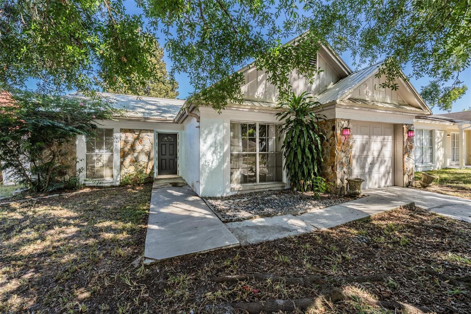 Welcome to Temple Oaks — where convenience, potential, and charm come together!
This 3-bedroom, 2-bathroom home with a 1-car garage offers the perfect opportunity for first-time homebuyers or anyone ready to put their personal touch on a space and truly make it their own. With no HOA and a location that’s both quiet and convenient, you’ll love the freedom and flexibility this property provides.
Step inside and you’ll immediately notice there’s no carpet anywhere—a huge plus for easy maintenance and modern living! The kitchen features stainless steel appliances, offering a great starting point for your dream kitchen remodel. The layout is comfortable and functional, with a nice flow between the main living areas and bedrooms, making it easy to imagine cozy nights in or weekend gatherings with family and friends.
The primary bedroom includes its own ensuite bathroom for added privacy, while the two additional bedrooms offer flexibility for a home office, guest room, or creative space. Both bathrooms are ready for your design ideas—fresh paint, new fixtures, and your personal touches will transform them beautifully.
Outside, the fully fenced backyard provides plenty of room for pets, play, or entertaining. The gardener of the family will fall in love with the raised garden beds and greenhouse, already set up and ready for growing your own herbs, vegetables, or flowers year-round. There’s even enough space to add a patio, firepit area, or outdoor dining setup to make the most of Florida’s sunny weather.
This home has great bones and features a durable metal roof, giving you peace of mind for years to come. Cosmetic updates like paint, new flooring, and a few finishing touches will go a long way in turning this property into something truly special.
The Temple Oaks community is known for its convenient location—you’re just minutes from shopping, dining, schools, and major commuter routes, making daily life simple and efficient. Whether you work locally or commute to nearby Tampa, this home offers the perfect balance of accessibility and affordability.
If you’ve been searching for a home that gives you the chance to build equity, customize your space, and enjoy the freedom of no HOA rules or fees, this is it. Homes at this price point with these features don’t come along often—especially ones with a fenced yard, stainless appliances, and room to grow your own garden oasis!
Don’t miss your chance to make this Temple Oaks gem your own. With a little vision and creativity, this could easily become your dream home — a place where you can plant roots, grow memories, and enjoy the Florida lifestyle to its fullest.