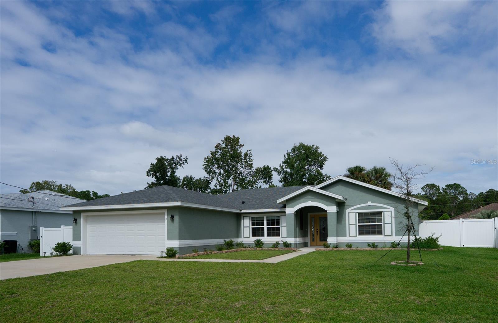 Beautiful Like New, 2024 year built Seagate Bryce floor plan located in the heart of Palm Coast. This nicely appointed concrete block home offers a popular open floor plan with a pleasing color palette, vaulted ceilings and tile in the main areas. The kitchen is nicely appointed with 42 inch cabinets with crown molding, granite countertops, tiled backsplash and stainless steel appliances. Large owners suite with tray ceiling and large bathroom with tiled shower, granite counters and double sinks. Fully fenced yard with irrigation system on a well make this home a must see!