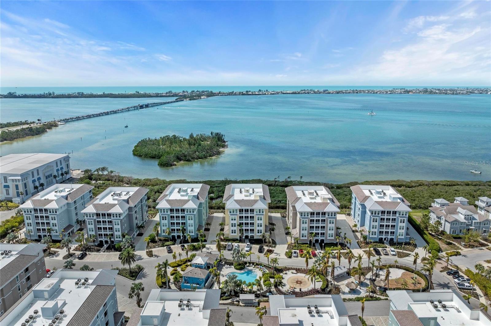 HUGE $25,000 PRICE IMPROVEMENT and TURNKEY FURNISHINGS ARE NEGOTIABLE! Look no further—unbelievable full water view! Perfection awaits you! Welcome to Paradise in the beautiful community of One Particular Harbour located in Harbour Isle on Anna Maria Sound. Water, water everywhere! This gorgeous, sophisticated, coastal, home has it all! Just move right in and start enjoying stunning sunsets over Anna Maria Island in this west facing, three-bedroom, three-bath condominium with spectacular views of Anna Maria Sound and even out into the Gulf from the open concept kitchen/living area, the Owner's suite and the large screened lanai. This spacious, beautiful home features three bedrooms, three baths, ungraded stainless steel appliances - including a double oven range, white 42” kitchen cabinets and stylish granite countertops. Other design upgrades throughout home include - wood look plank ceramic tile, plush carpet in bedrooms, 5” Base Boards, triple sliding glass doors, ceiling fans, upgraded light fixtures, just to name a few. It features a dedicated covered parking space which will accommodate your vehicle and a designated storage unit, large enough for all your outdoor fun toys. This home could be a great investment opportunity or a lovely full-time home. It is strong and built to last! Harbour Isle is second to none. It starts with the amazing 23, 000+ square foot Beach Club where you can raise a glass at the Sky Bar and toast the sunset and continues with the heated resort pool, spa, kayaks and the 4,200 square foot fitness center. There are four pools for your use and the closest to the home is the Margaritaville inspired pool, cabana, splash pad, grill area and playground that is right out of your front door. Enjoy all the walking trails around Harbour Isle — over two miles! If you have a boat, the wet/dry Safe Harbour Marina is the perfect place for you at Pier 77 - a quick walk from this beautiful condo. Right outside the gated community is Floridays Restaurant and the Compass Hotel. There are amazing restaurants to enjoy throughout Anna Maria, Bradenton and Sarasota. This home is located just a little over a mile from the sugar sand beaches and quaint island charm of Anna Maria Island and two miles from the famous Robinson Preserve with over five miles of walking, biking, kayaking and bird watching. Walk or bike to three different nature preserves from this home. Live, relax, enjoy an active lifestyle or purchase as an excellent investment in award-winning Harbour Isle. This is truly Paradise and this easy, breezy coast living can be all yours! Come see it today! You will surely be impressed!