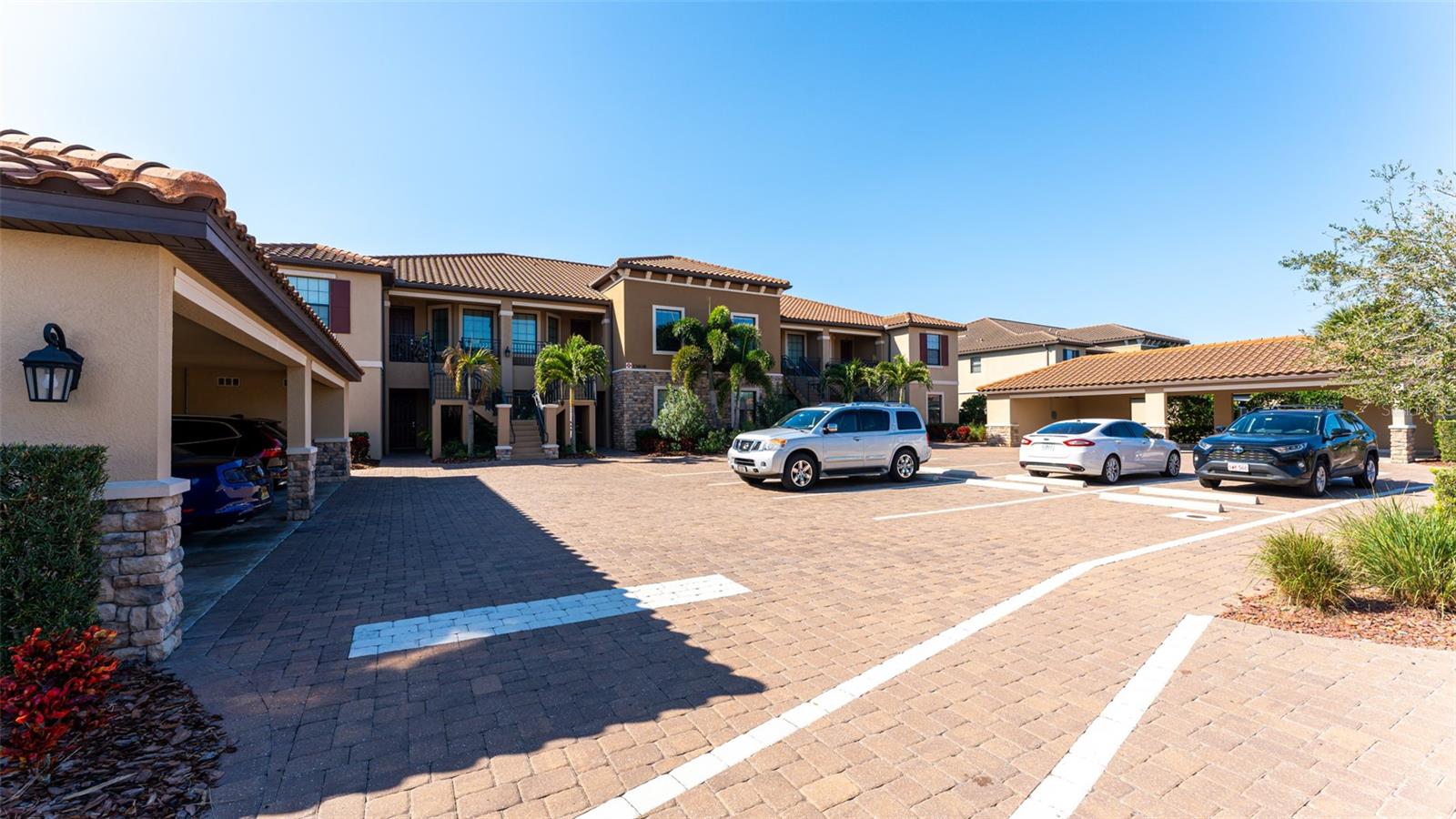 FURNISHED ANNUAL RENTAL. Beautifully furnished 2 Bedroom 2 Bath Condo with Den in the sought after community of Esplanade at Lakewood Ranch! This first floor end unit offers granite counters, stainless appliances, eat in kitchen, breakfast bar, formal dining area, great room/kitchen combo with private tropical landscape view. Split bedroom plan with on suite guest bedroom area. Master suite offers a Queen Bed, 2 walk in closets, his and her sinks in master bath, walk in shower. Guest bedroom offers twin beds. Separate Den/Office with doors for privacy and a murphy bed for additional guests! Comfortable sectional seating on lanai. Enjoy resort style living with 18 holes of Golf, Culinary Center, Formal Dining in Main Clubhouse, Pizza Kitchen, Lagoon Style Pool with Private Cabanas, full service Tiki Bar, State of the Art Fitness Center with classes, Day Spa, Tennis Courts, Bocce Ball, Pickle Ball and more! Owners Membership Transfers for just $600, Golf Fees Additional. AVAILABLE AS AN ANNUAL RENTAL BEGINNING May 16, 2025 $2750/MONTH PLUS ELECTRIC AND CABLE/WIFI. Small Dog Ok with non-refundable $300 pet fee.