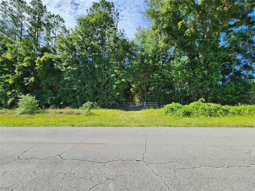 **13 Acres of Natural Paradise Near Ichetucknee Springs State Park** Discover your own slice of heaven with this stunning 13-acre property, a nature lover's dream come true. Nestled alongside the serene Ichetucknee Springs State Park, this unique parcel offers unparalleled privacy and a wealth of natural beauty. **Property Highlights:** - **Apiary:** Perfect for beekeeping enthusiasts, enjoy fresh honey right from your backyard. - **Shed:** Ample storage space for all your tools and equipment. - **Pitcher Pump:** Traditional water source, adding rustic charm and functionality. - **Deer Stands & Feeders:** Ideal for hunting enthusiasts, with established stands and feeders to attract local wildlife. - **Fruit Trees:** Savor the fruits of your land with a variety of established fruit trees. - **Garden Areas:** Plenty of space for growing your own vegetables and herbs. - **Gated Driveway:** Ensuring security and privacy, your own private retreat. - **Paved Road Access:** Easy access year-round, just off a well-maintained paved road. - **Close to Local Springs and Rivers:** Enjoy swimming, kayaking, and tubing in the nearby crystal-clear springs and rivers. Located near the North entrance of Ichetucknee Springs State Park, this property is a rare find. Whether you're looking for a hunting retreat, a place to enjoy outdoor activities, or a peaceful escape from the hustle and bustle, this land offers endless possibilities.