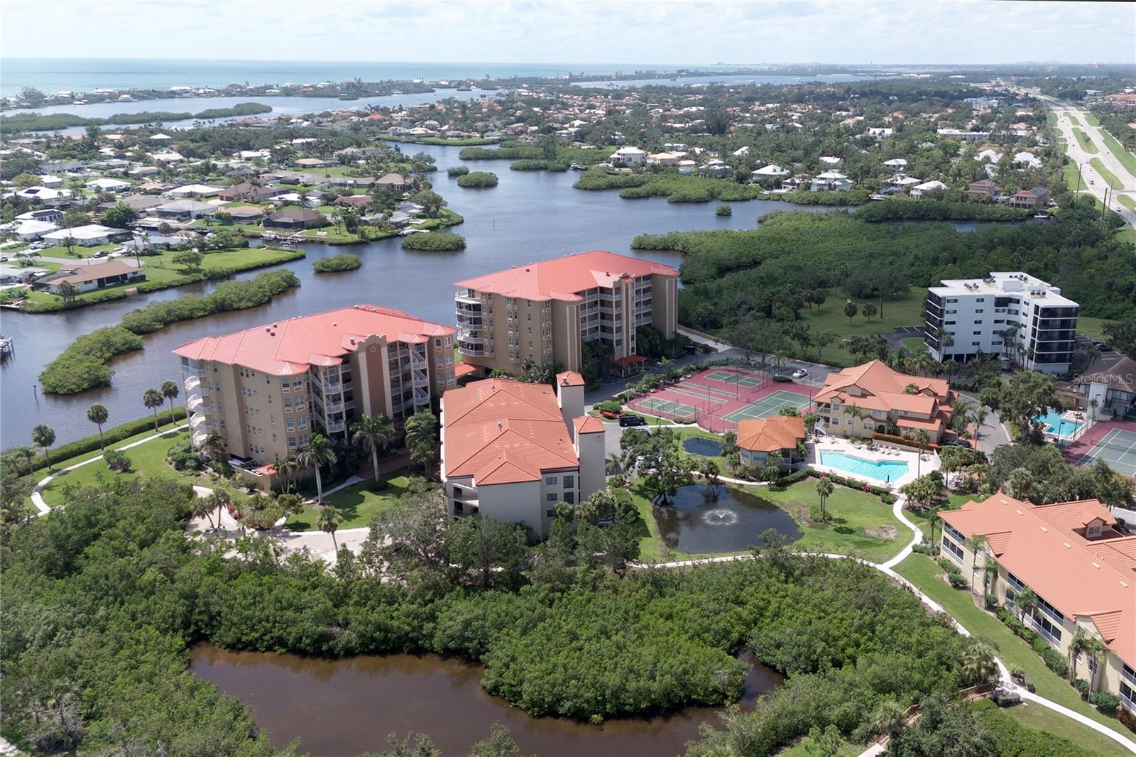 PENTHOUSE CONDO IN WATERFRONT COMMUNITY!
Experience luxury coastal living in this spacious 3-bedroom, 2-bath penthouse condo, perfectly situated on a tranquil canal with dockage and direct, bridge-free access to the Intracoastal Waterway and the Gulf. This impressive 3rd-floor residence features an open floor plan with expansive rooms, plantation shutters, and three private balconies—ideal for soaking up the Florida sunshine and enjoying great views.
The gourmet kitchen is a chef’s dream, offering granite countertops, wood cabinetry, stainless steel appliances, and a cozy eat-in area for casual dining. The expansive master suite boasts a private balcony, two walk-in closets, double vanities, a soaking tub, and a separate shower for ultimate relaxation.
Additional highlights include a wet bar for entertaining and three separate balconies for outdoor living. Enjoy resort-style amenities such as tennis courts, pickleball, shuffleboard, a heated pool, clubhouse, walking paths, a workout facility, and a convenient kayak launch for endless waterfront adventures. Bring your own boat and take advantage of your separately available assigned boat dock area!
When you’re ready to explore, you’ll find yourself just 10 minutes from several Gulf Coast beaches, thousands of acres of parks and preserves, and world-class shopping, dining, and fishing. Quick connections to Sarasota’s vibrant arts scene, the new Mote Marine Aquarium, Spanish Point, the Legacy Trail, and Oscar Scherer State Park are all just minutes away. All of this and you will just be 5 minutes from I-75 where the rest of the world awaits you.
Take the elevator to your nearby 2 assigned parking spots under the building.
Don’t miss your chance to own this exceptional penthouse—schedule your private showing today!