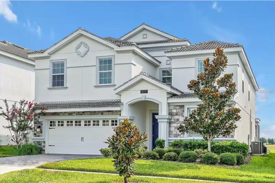 MUST SEE THIS FULLY DISNEY-THEMED POOL HOME WITH LAKE VIEW IN ONE OF THE MOST FAMOUS GOLF RESORTS NEAR ORLANDO: CHAMPIONS GATE COMMUNITY!   OWNERS SPENT $125,000 IN UPGRADES!  Super low HOA fees of $531/month!  This impressive 8-bedroom, 5-bathroom estate has been professionally designed by an interior decorator, making it the ultimate retreat for a fun-seeking family or groups looking for an unforgettable vacation experience.  With exceptional reviews on Airbnb/VRBO, this property comes with positive rental history, with potential for generating even more rental income.  Actively managed across many platforms and will transfer to new owners. Turn-key and ready to generate income from day one. There are many professionally decorated/themed rooms with custom murals featuring Super Mario Brothers, Mario Kart, Yoshi and Bowsers Castle.  There is a life size Nintendo Switch gaming station, air hockey table, foosball table and two classic gaming stations.  Relax with family in the private Movie room with theatre seating, large projection screen and surround sound!  Spend an afternoon with friends around your private heated pool with comfortable patio furniture, outdoor dining area and ping pong table!  Don’t forget, this home is one of the few in the area with a lake view!  Enjoy a good meal in the oversized kitchen with stone countertops, stainless steel appliances and huge island.  Oversized master suite downstairs with large vanity, garden tub and separate shower.  Champions Gate world-class amenities include: 10,000 sq/ft clubhouse, fitness center, pools, lazy river, waterslide, theater, game room, restaurant, tiki bar, cabanas, tennis, volleyball, two Greg Norman designed golf courses, Resort-style dining, shopping and entertainment.  Located just minutes from Walt Disney World, Universal Studios and Orlando attractions.   HOA includes Internet/Cable and Lawn maintenance and Daily Trash. Schedule a showing TODAY!  NO FLOOD ZONE.  HVAC and HW-Heater recently replaced.  Garage was converted to an entertainment room, but can be converted back to traditional garage.