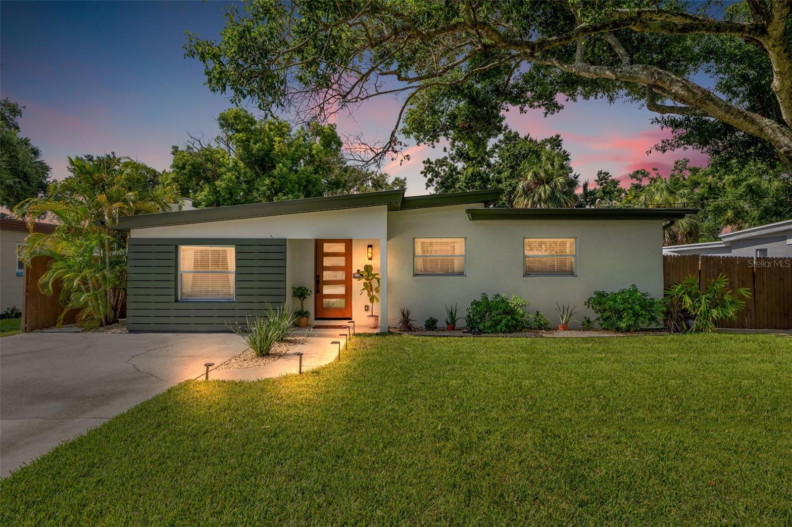 Welcome to your dream home—an exquisitely renovated Mid-Century Modern retreat in the heart of South Tampa!
This stunning 4-bedroom, 2-bath block construction home seamlessly blends timeless Mid-Century Modern architecture with upscale contemporary design. Bathed in natural light, the spacious open floor plan and VAULTED KITCHEN CEILINGS create an airy, inviting atmosphere perfect for modern living and entertaining.
At the heart of the home, the designer kitchen features floor-to-ceiling solid wood cabinetry, granite countertops, stainless steel appliances, and soft-close drawers. A cozy breakfast nook overlooks the lush, private backyard, creating a seamless indoor-outdoor connection.
Extensive updates and energy-efficient improvements include:
Newer insulated TPO roof (2018),
Structural Insulated Panels (SIPs) in the kitchen, dining room, and owner’s suite. (2018)
Spray foam insulation in the attic,
Zoned mini-split HVAC systems (2018), with new units in the kitchen and primary suite (2024).
New electrical panel and full plumbing replacement (cast iron removed). (2018)
Tankless water heater, double-pane windows, and low-flush toilets. (2018)
Smart switches connected to all indoor and outdoor recessed lighting.
LED lighting, upgraded insulation, and Deco tile flooring in bathrooms.
New solid wood interior doors (2024) and luxury vinyl plank flooring (2024).
Fresh exterior paint (2024) and new landscaping (2024).
The thoughtfully designed split-bedroom layout provides comfort and privacy, while a stylish geometric tile wood-burning decorative fireplace anchors the living space. Smart home features, including a Ring doorbell and security system, giving convenience and peace of mind.
Step into your private backyard oasis, ideal for relaxation or entertaining, featuring:
A covered cabana for shaded lounging.
Two patio areas perfect for outdoor dining and grilling.
Fresh tropical landscaping and a fully fenced yard.
A storage shed for tools, bikes, or gardening supplies.
Location highlights:
Minutes to Bayshore Boulevard, Downtown Tampa, MacDill AFB, and Tampa International Airport
Steps to Dutch Bros Coffee and other local favorites.
Close to shopping, dining, parks, and top-rated South Tampa schools.
This is a rare opportunity to own a fully updated, energy-efficient Mid-Century gem in prime South Tampa real estate. Don’t wait—schedule your private showing today and make this one-of-a-kind property yours! FLOOD ZONE X - NON FLOOD ZONE