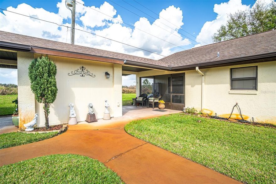 Nestled within the peaceful Pines on Lake Huntley, this charming condo offers serene water views and access to resort-style community amenities. Residents enjoy a sparkling pool, a scenic boardwalk along the shoreline, and a lakeside park with pavilion, picnic seating, and a grill. The shared dock features a relaxing sitting area, and Lake Huntley itself offers two public boat ramps for easy water access.



This charming home features brand new luxury vinyl flooring, front and rear enclosed porches, a convenient indoor laundry room, and covered parking. The well-kept, pet-friendly community offers a lifestyle of comfort and convenience, with the condo fee covering electricity, maintenance, grounds, pest control, pool maintenance, and water, making it easy to enjoy your home and the amenities worry-free.



Set just minutes from local shops, dining, and recreation, this property combines natural Florida charm, lakeside living, and modern convenience. Whether relaxing at home or enjoying all the community has to offer, this condo delivers a true lakeside retreat.