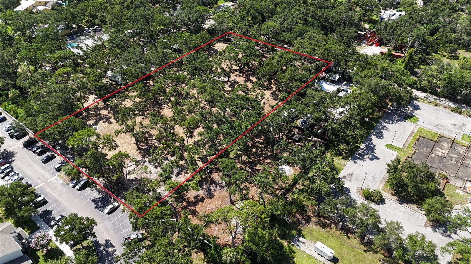 Looking for a perfect location to build your dream home? Or perhaps develop a minor subdivision? Look at this! Approximately 6 blocks (.8 miles) south of University Parkway (2 blocks south of Desoto Road) and just east of Lockwood Ridge Road at 51st Street! Only 3.8 miles to the University Town Center Mall and only 3.3 miles to the Sarasota International Airport! Parcel is an assemblage of three contiguous lots under the same ownership on 51st Street, measuring 2.11 acres total, starting at the third lot on the north side of 51st St from the corner at Lockwood Ridge Rd. Current zoning is RSF2/Residential, Single Family, 3.5 units/acre. Interesting property for a potential small single family subdivision or possibly rezone for townhomes/multi-family. All three lots have been freshly bush-hogged and enjoy the shade of several large oak trees.