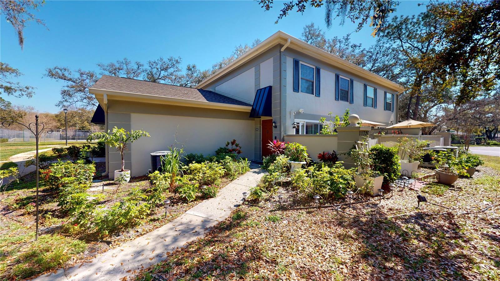 Welcome to this beautiful two-bedroom, two-bath condominium in the sought-after Raintree Village community near the University of South Florida. This beautifully landscaped neighborhood features mature oak trees, tennis courts and swimming pools. Enjoy maintenance-free living in this charming home featuring a spacious open-concept great room, ceramic tile in main areas, and carpet in bedrooms. All appliances included—washer & dryer too! Natural light fills the spacious living area through sliding glass doors, creating a bright and inviting atmosphere. Prime location—just minutes to USF, shopping, dining, entertainment, interstates, and more!