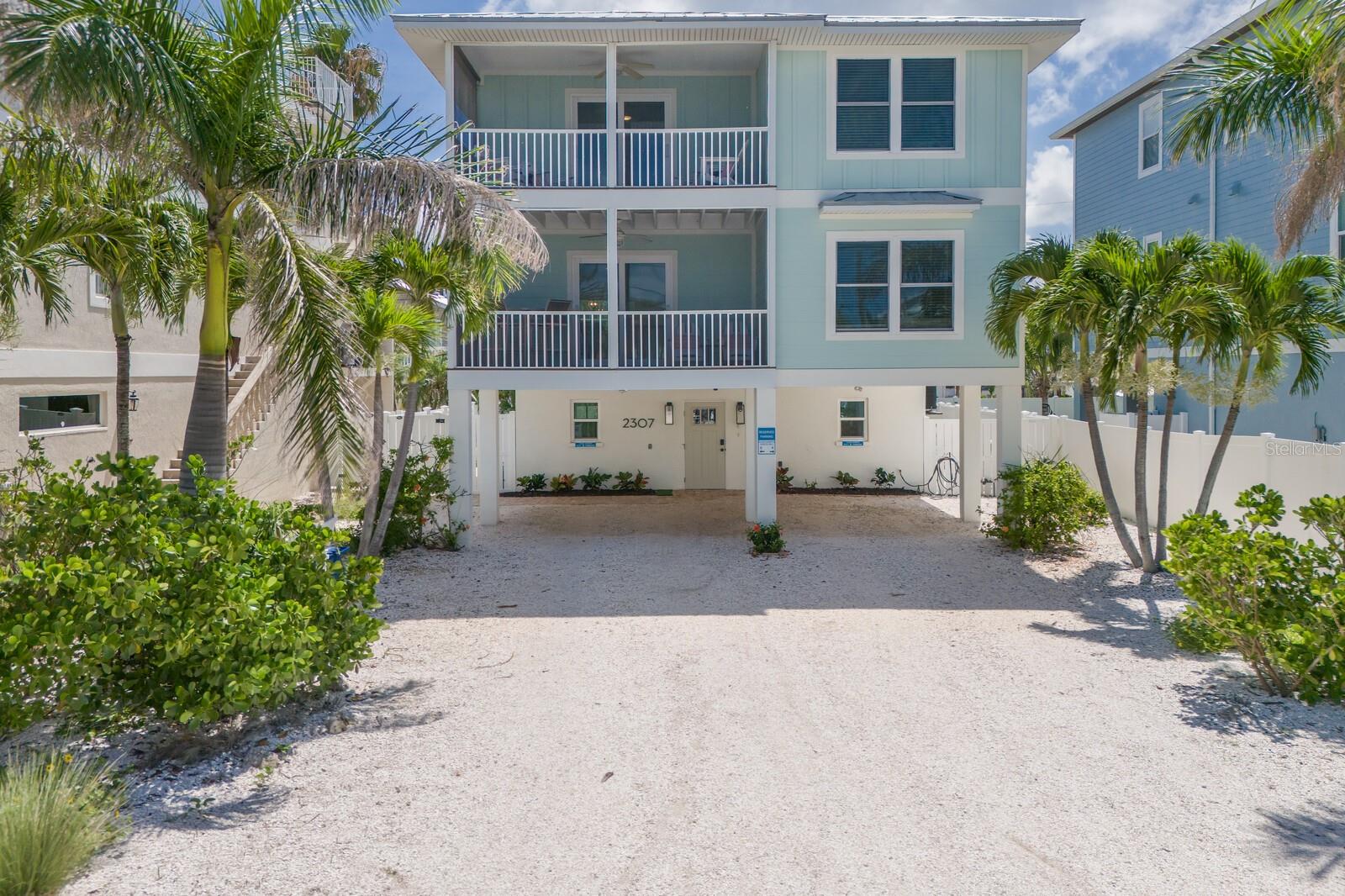 Elevated 5 bedroom 4 bath, two unit duplex, turnkey and ready to go. Endless opportunity awaits you! Experience the laid back beach atmosphere of Anna Maria island from this beautifully maintained three story elevated duplex. This 5 bedroom 4 bath vacation rental home with heated pool is perfectly located within a short distance to the beach and the Intracoastal waterway . Currently a very active vacation rental, this property offers you the ability to start earning income immediately as you enjoy your vacation home. Perfect as a primary residence, second home, or strictly as a vacation rental investment property, this one has it all for you. Featuring lovely coastal decor, updated kitchens and baths, along with new impact windows, new metal roof 2020, new Hardie board cement siding 2023, and newer AC units 2020/21. Each unit boasts a lovely spacious kitchen, dining area and living room with a screened in balcony/deck. The second floor unit offers 3 bedrooms and 2 baths, charming kitchen, and a spacious living area that opens to the screened in balcony ideal for your morning coffee or late evening drink of choice. The third floor unit offers you 2 bedrooms and 2 baths, with beautiful views of the intracoastal waterway with endless morning sunrises and in the evening, off the front of the home from your screened in balcony, you will experience beautiful gulf water views and gorgeous sunsets. If you are looking for a great investment opportunity or a place to call your home, 2307 Ave C offers the best of both. Come along and start enjoying all that Anna Maria Island has to experience with her lovely sand, gorgeous beaches, outdoor water sports, out door living , quaint shops, wonderful restaurants, and magnificent sunsets. Seller only pays $700 a year for Flood insurance on this one!