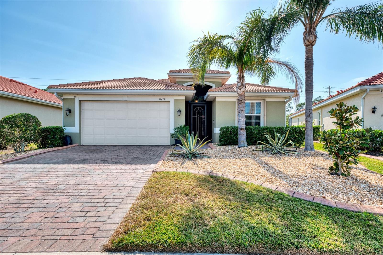 Stunning Pool Home in the Desirable Community of Caribbean Village in Venice, FL. Welcome to 11479 Blackfin St, a beautifully designed Edison floor plan with 3-bedrooms, 2-bathrooms, plus a DEN/FLEX ROOM WITH GLASS DOUBLE DOORS, offers a perfect blend of comfort, functionality, and modern elegance. Enjoy the Florida lifestyle at its finest with your very own PRIVATE POOL, complete with a HEATER, WATER FEATURE, and a large screened lanai – perfect for outdoor relaxation and entertaining. The spacious kitchen is a chef's dream, featuring a large island that comfortably seats 4 and opens to the living and dining areas, making it ideal for family gatherings and socializing. GRANITE COUNTERTOPS IN KITCHENS AND BATHS, UNDER CABINET LIGHTING, GLASS BACKSPLASH, CROWN MOLDING, 8-FOOT DOORS, and LARGE DIAGONAL TILE FLOORING add a touch of luxury. The home is equipped with ceiling fans for comfort and upgraded features such as blinds on all windows and a UV LIGHT SANITIZER FOR THE HVAC SYSTEM. The pool area is a true standout, with the POOL PUMP REPLACED in 2020 and the POOL HEATER INSTALLED in 2018. Additional features include UPGRADED ACCORDION HURRICANE SHUTTER AND ROLL-DOWN STORM SCREEN FOR THE LANAI AND FRONT ENTRANCE (a $20K Value), whole-house gutters, and a surge protector for the electrical panel. For added convenience, the home is PRE-WIRED FOR A GENERATOR and a GENERATOR INTERLOCK SYSTEM IS ALREADY IN PLACE. The living room, entryway, master bedroom and bathroom have TRAY CEILINGS for added elegance. The property also boasts EPOXY FLOORING IN GARAGE and landscape edging for a polished look. PATIO FURNITURE INCLUDED. Located JUST 7 MILES FROM THE BEAUTIFUL BEACHES OF VENICE and offering easy access to I-75, this home is in a prime location (NOT IN A FLOOD ZONE) close to golfing, restaurants, Wellen Park, and historic downtown Venice. Enjoy the best of Florida living in a maintenance-free community with two gated entrances, a community pool with clubhouse, fitness center, and bocce ball courts. With low HOA fees and no CDD, this home provides both luxury and affordability. Don't miss out on this opportunity—schedule your showing today and be sure to check out the virtual tour, which includes a walking tour of Venice! This home is move-in ready and waiting for you to make it your own. As an added bonus, Seller is offering $2000 in Home Depot Gift Cards to replace carpet in master bedroom. Lanai furniture on site, master bedroom furniture, TV's and brown desk in guest bedroom will convey at no charge. Cameras on site.