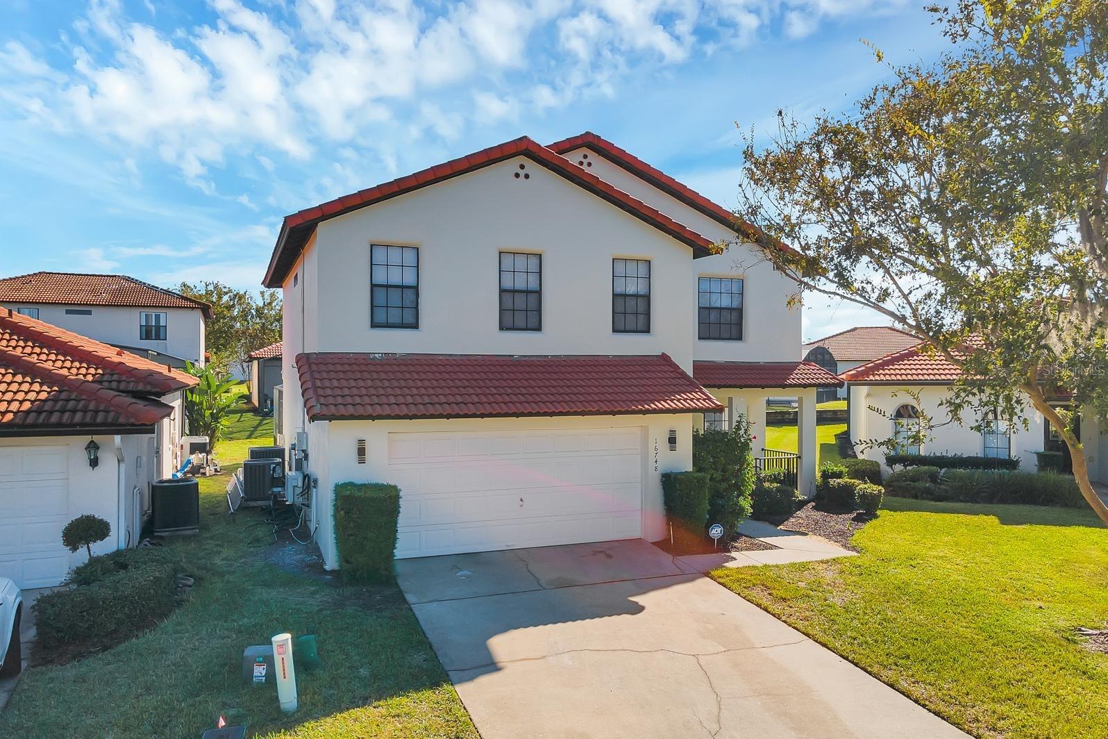 Wonderful Mediterranean Style 2 Story home. 4 Bedrooms, 2.5 Bathrooms located in a Gated Community with many amenities. Located close to US 27 and US 192 and close to many Attractions, Shopping, Restaurants and entertainment. This lovely home is waiting for it next tenant. The main floor has a large oversized living area, kitchen, with dining area, half bath which leads to the pool area and a laundry room. The 2nd floor has the Owner's Suite and Bath, 3 additional Bedrooms and Guest Bath. Owner's Suite Bath has garden tub and separate shower as well as a dual sink vanity. As you walk out of the rear of the home you will find an outdoor oasis with built in solar heated pool and jacuzzi. Stainless appliances. The Gated Community has a large Clubhouse perfect for gatherings or a relaxing day at the Community pool and hot tub, movie room with games, fitness center, play room, pool table and more. There is a playground right outside the Clubhouse with a small miniature golf area. 24 hour community gate. Make this lovely home your next location to live. If you desire to have the home fully furnish, the option is also available for $500 more a moth!