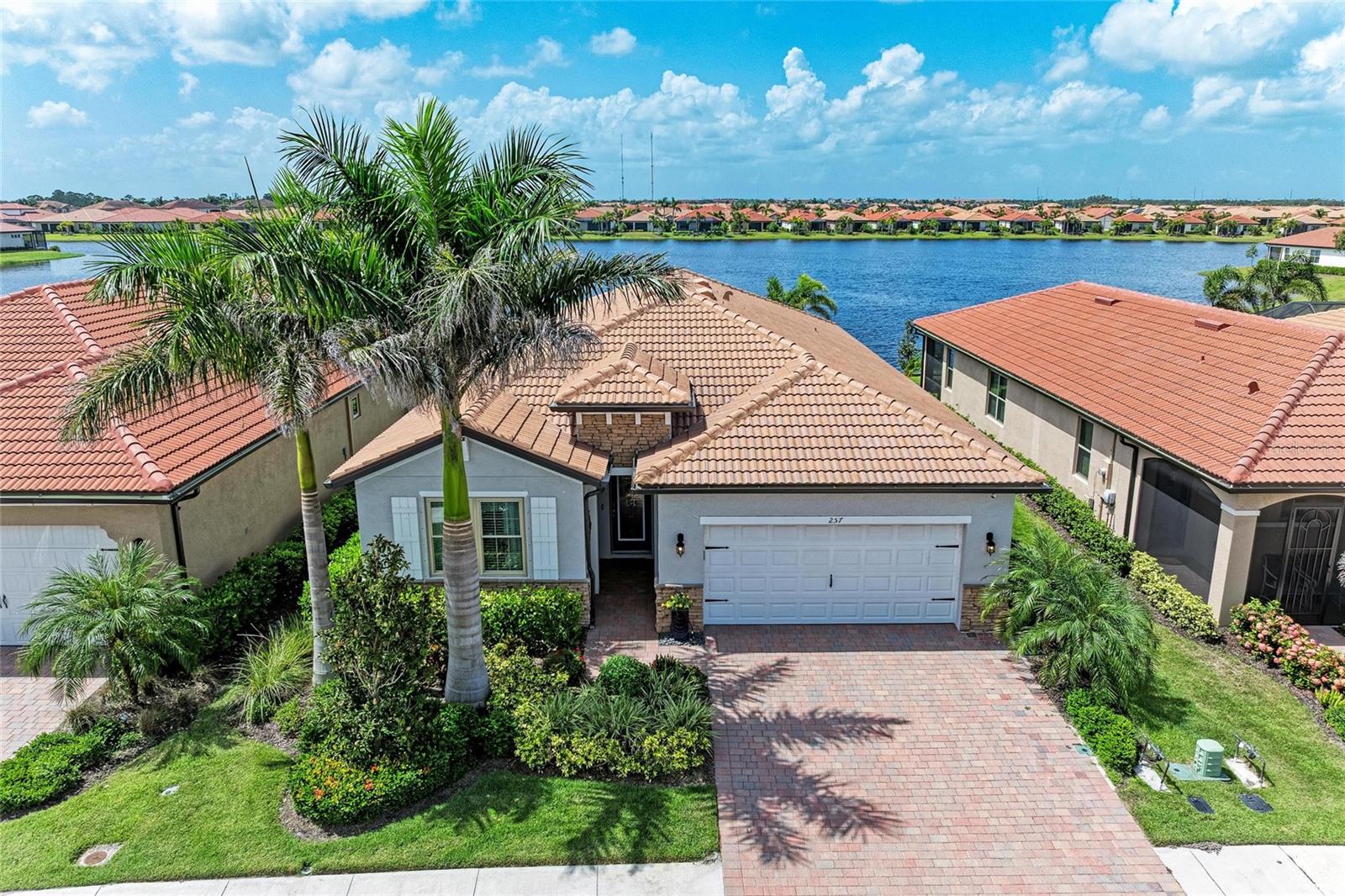 You're going to love this opportunity! Here’s your chance to own an almost new, fully upgraded home boasting either 4 bedrooms or 3 bedrooms plus a cozy den, all beautifully situated on a desirable southern exposure waterfront lot. The home comes with hurricane impact windows and sliding glass doors, plus lanai hurricane screens to keep you safe and comfortable. Say goodbye to carpets, as you'll find stylish wood plank tile flooring throughout! The kitchen is bright and welcoming, featuring modern white shaker-style cabinets, under-counter lighting, handy pull-out shelves, quartz countertops, stainless steel appliances, and a charming backsplash. You will feel right at home in the spacious primary suite, which offers two walk-in custom closets and a lovely walk-in shower with ceiling-height tile, decorative listello, grab bars, and dual sinks. The thoughtful split floor plan ensures your guests or family have their own space, giving you all a sense of comfort and privacy. And let’s not forget the roomy laundry room that's equipped with a farm sink and plenty of cabinets for extra storage. With blinds on the sliding glass doors, plus some stylish designer fans and light fixtures, everything is finished for your ease and enjoyment. Toscana Isles is more than just a community, it's a vibrant lifestyle! This gated, maintenance-free neighborhood is perfect for anyone looking to lead an active and fulfilling life. You’ll have endless opportunities for kayaking, canoeing, and fishing on over 200 acres of interconnected lakes. Plus, the 8,000-square-foot clubhouse is a fantastic spot, complete with a fitness center, ballroom, billiard room, and big-screen TVs for movie nights! Located just 10 minutes from the beautiful Suncoast beaches, you’ll find easy access to the Legacy Bike Trail and the charming downtowns of Venice and Sarasota, with plenty of cultural experiences, delightful shopping, and amazing dining just around the corner. And with the new Sarasota Memorial Hospital Venice Campus close by, exceptional healthcare is right at your fingertips. So, don’t wait! Give us a call today for a private showing and let’s help you start living the life you’ve always hoped for!