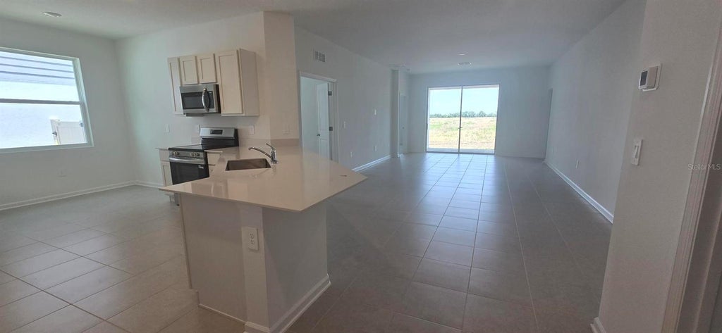 Photo of 3024 Chicago Avenue, Haines City, FL 33844 (MLS # O6448642)
