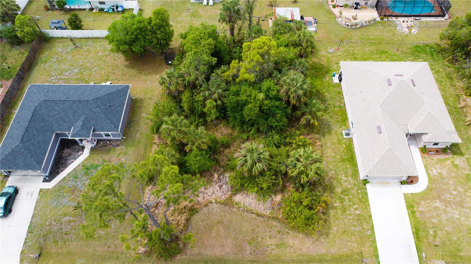 Discover an exceptional piece of land in the fast-growing city of North Port, perfect for residential living or investment. This prime lot offers a peaceful setting with convenient access to major roads, top amenities, and the breathtaking Gulf Coast beaches. Whether you’re planning to build your dream home or a vacation retreat, this property presents endless possibilities. Located in a thriving neighborhood surrounded by newly built homes, this buildable lot boasts excellent potential for your next project. North Port is home to the Atlanta Braves Spring Training Complex and offers an array of outdoor activities, with over 80 miles of freshwater canals, 26 community parks, and proximity to the scenic Myakka State Forest. Nature lovers will appreciate the area’s rich archaeological history, natural springs—including the famous Warm Mineral Springs—and abundant opportunities for birdwatching, hiking, kayaking, and cycling.
This property is NOT in a flood zone and has NO HOA restrictions, giving you more freedom to create your perfect home. Plus, it’s just minutes from golf courses, world-class fishing, boating, and the exciting North Port Aquatic Center, featuring a 25-meter stretch pool, water slides, and a lazy river. With easy access to US-41 and I-75, you're conveniently located between Tampa and Fort Myers, opening the door to a wealth of lifestyle opportunities. Don't miss out —claim your piece of paradise today! Call now for more details or to schedule a viewing.