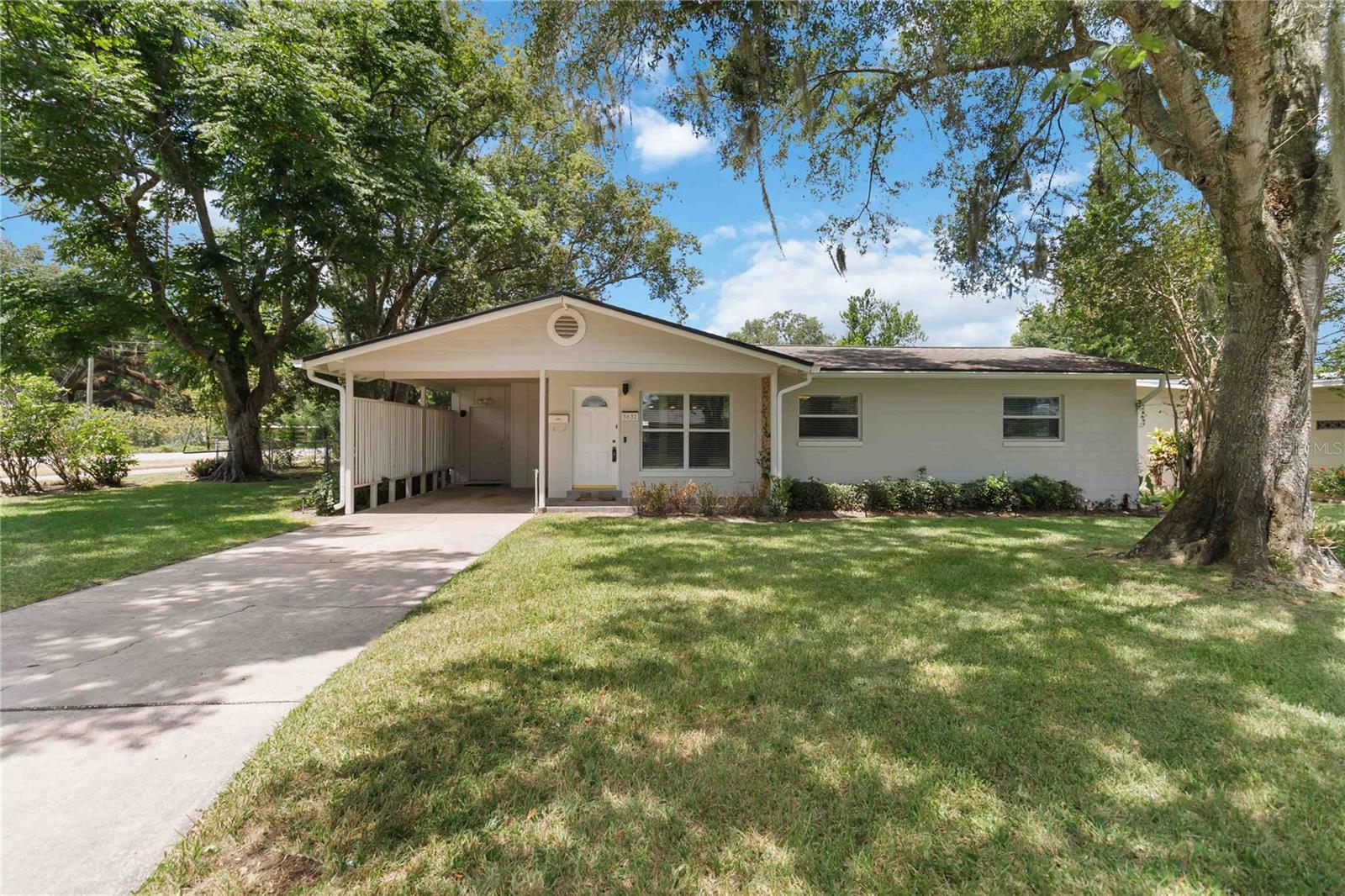 Amazing opportunity to own a stunning 4/2 corner lot home in a quiet Downtown Orlando community . NO HOA. This home has a beautifully updated kitchen with granite counter tops when you walk in! Hardwood Floors and Plank ceramic tile for durability and sophistication throughout the home. This 4 bedroom home has an oversized primary bedroom with the added privacy of the split floor plan. The oversized Utility room could also be used as a craft room or office. Gigabit AT&T fiber optic wired in, just activate your own account! The large Living room has an oversized wood burning fireplace as the center point of the room and a separate family room by the kitchen for all your guests to enjoy! Just minutes in the morning when heading to the A rated schools close by. Rear fenced yard for your pets to enjoy! Brand new septic tank and drain field in 2025! Plumbing was re-piped in July of 2024! New main electrical panel June of 2024. Exterior painted in January of 2024. Roof was replaced in 2017 and new water heater in April 2022. All giving this home the solid bones you are looking for. All of this, located just minutes from the downtown scene with restaurants, shopping, sporting events and entertainment! Don't miss it!