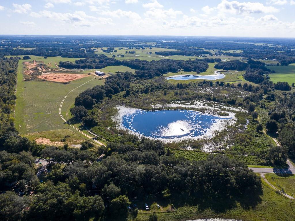 UNIQUE PROPERTY with so many options!! This property is currently zoned, set up and operated as a Private Motocross/Supercross Training Facility. the Zoning and permit are transferable. 74 ACRES fully fenced featuring a motocross and supercross track, a 6,000 sqft steel building, and an 1,800 sqft water truck building. If desired, this property is also platted for a subdivision, single family dwelling up to 2 acres each. There is so much to this property, so book your appointment now to learn more!