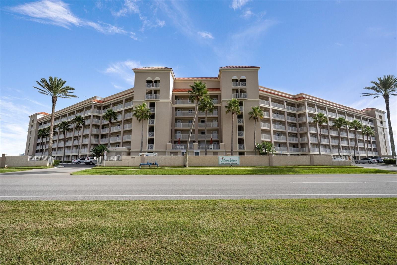 Welcome to your slice of paradise on the no-drive beach of New Smyrna Beach, FL! This beautifully renovated 2-bedroom, 2-bathroom oceanfront condo offers everything you need for a relaxing coastal lifestyle—or a lucrative investment property. Wake up to breathtaking sunrises from your private oceanfront porch, and enjoy panoramic views of the Atlantic Ocean from the comfort of your living room or primary suite. Inside, the condo features thoughtful updates including a brand-new A/C unit (March 2025), a newer hot water heater, and the convenience of an in-unit washer and dryer. Perfect for families or groups, the unit comfortably sleeps 6+ with two sets of bunk beds featuring queen-size mattresses below—ideal for maximizing rental potential or hosting guests. Located in a highly desirable Sandpiper community with a proven track record of strong rental income, this unit is a smart investment and a serene getaway all in one. Community amenities include two oceanfront geothermal pools, two baby pools, a putting green, a tennis/pickleball court, and private beach access—all just steps from your door. Additional perks include a secure storage unit and direct access to the pristine, no-drive stretch of New Smyrna Beach. Don't miss this rare opportunity to own a turnkey oceanfront condo—whether for personal enjoyment, investment income, or both!