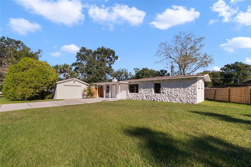 Welcome to a stunning newly renovated Sanford home! Newly painted exterior and interior. Absolute gorgeous fully renovated kitchen with modern farm sink, large cabinetry with lots of space for kitchen storage. Granite countertops and a new backsplash. Stainless steel appliances and an extra bonus is the newly installed niche dry bar! Can not forget to mention the great amount of lighting. New luxury plank flooring throughout the home. This home features 2 bedrooms with en suite bathrooms and a third full bathroom for guests. All bathrooms are newly fully renovated with large format tile. The home features an open concept for gatherings and entertaining. A wood burning fireplace in the family room adds superior comfort. New AC 2023 to come. New Electrical panel and wiring 2023. A fenced in yard. One car detached garage is perfect for storage, a workshop or to park your car or golf cart. Approx 1 mile from Downtown Sanford where you can enjoy shopping for antiques, music, festivals, bars, restaurants and so much more. Approx 1 mile from the beautiful Lake Monroe which has a beautiful walking trail and boat marina. Schedule your viewing now for this sought out home in Sanford!