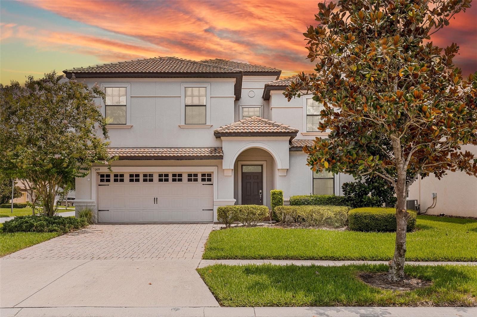 **Welcome to this stunning 8-bedroom, 5-bathroom fully furnished retreat in the sought-after gated community of Champions Gate.** From the moment you step inside, you’ll be greeted by an expansive foyer with bright tile floors that guide you into the open-concept main living space.
The heart of the home features a spacious living room with plush seating, a wall-mounted TV, and large sliding glass doors that bathe the space in natural light. The adjoining dining area offers seating for the whole group, while the fully equipped kitchen boasts granite countertops, stainless steel appliances, a large island with breakfast bar seating, and ample cabinetry for storage.
Just beyond, step out to the screened lanai with a sparkling private pool and spa—perfect for sunny afternoons or relaxing evenings. The covered patio offers shaded seating for outdoor dining, and the updated pool enclosure (2024) provides peace of mind.
The first-floor primary suite offers a calm retreat with a king bed, walk-in closet, and spa-like en-suite bath featuring dual vanities, a soaking tub, and a separate walk-in shower. A second bedroom on the main level is designed for comfort and convenience, ideal for guests or multi-generational living.
Upstairs is where the home’s personality shines. Multiple themed bedrooms create a one-of-a-kind experience, including a **Star Wars–inspired room** with custom murals and bunk beds, a **Frozen-themed room** with whimsical décor, a **101 Dalmatians–themed room** and a **superhero-themed room** with bold colors and dynamic wall art. Additional upstairs bedrooms feature modern, neutral décor with king and queen beds to suit a variety of guest needs.
The upstairs loft has been converted into a **movie theater room**, complete with tiered theater seating, two massage chairs, and a large-screen setup—ideal for immersive movie nights. On the main level, the garage has been professionally converted into an **air-conditioned game room** with carpeting, a custom **Star Wars Cantina–themed mural**, a 70-inch LG NanoCell TV, pool table, foosball table, and an arcade game cabinet (currently in need of repair).
Recent updates include **two new A/C units (2024)** and a **new water heater (2025)**. A dedicated laundry room adds everyday convenience.
Residents and guests enjoy The Oasis Club amenities, including resort-style pools, lazy river, water slides, tiki bar, full-service restaurant, movie theater, fitness center, and sports courts. Ideally located just 15 minutes from Walt Disney World with easy access to major highways, this property is perfect as a Davenport vacation rental, short-term investment, or Orlando relocation home. Contact us today to schedule your private showing.