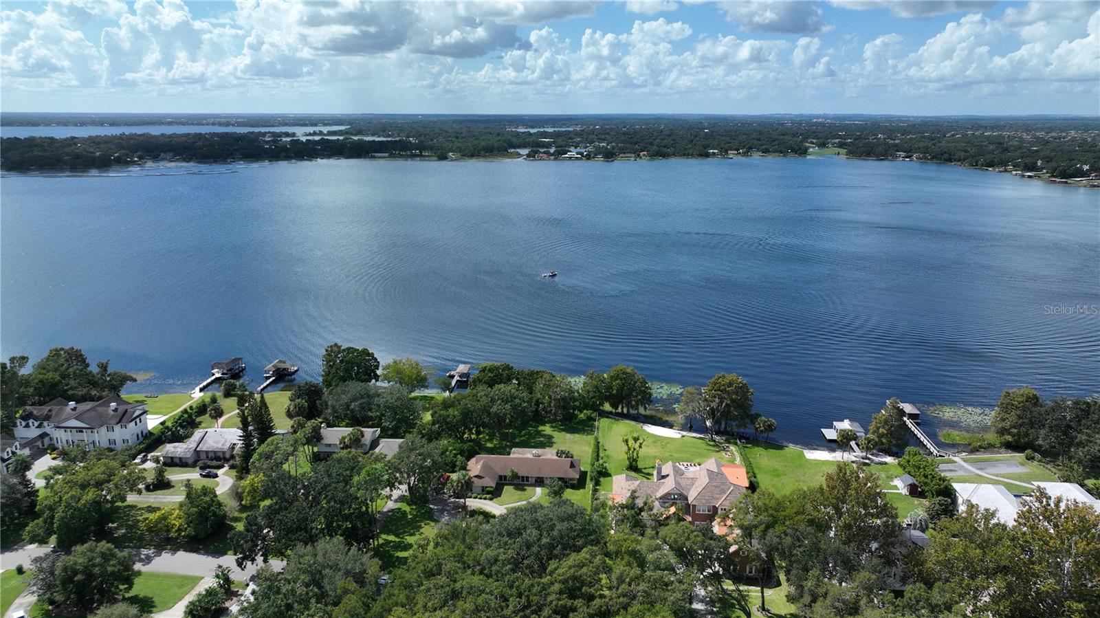 Here is your chance to build your dream home on Lake Down, one of 12 lakes that make up the Butler Chain of Lakes in Windermere, FL. The lot is approximately 1 acre high and dry and has 130 feet of shoreline. Lake Down Shores is a non/gated neighborhood with mature trees. Watch the sunset every evening and the Disney fireworks from your dock. Easy access to the 408, Florida Turnpike and the 429.