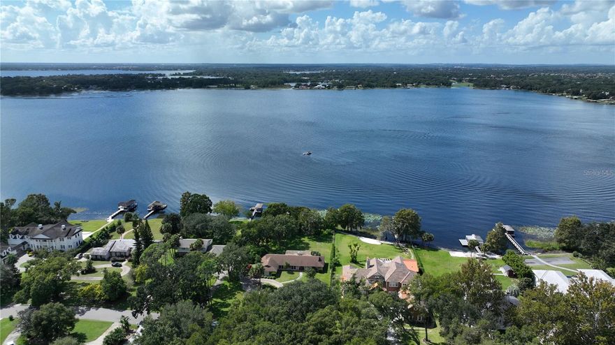 Here is your chance to build your dream home on Lake Down, one of 12 lakes that make up the Butler Chain of Lakes in Windermere, FL.  The lot is approximately 1 acre high and dry and has 130 feet of shoreline.  Lake Down Shores is a non/gated neighborhood with mature trees. Watch the sunset every evening and the Disney fireworks from your dock.  Easy access to the 408, Florida Turnpike and the 429.