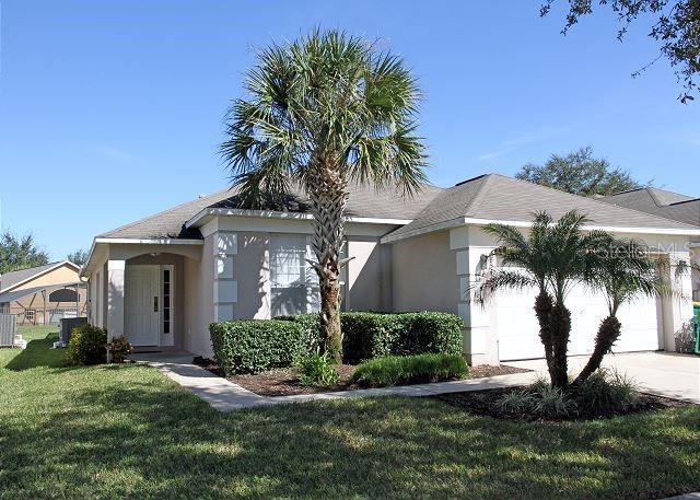 Fantastic fully furnished single family home located in a popular community of Emerald Island Resort. Both primary bedrooms had the floors changed to Laminate in 2023. The roof was also replaced in 2023. This exclusive resort called EMERALD ISLAND is located in Kissimmee Florida just 5 minutes from Disney World. The community has a dramatic palm tree lined boulevard, passing lakes with fountains and sculptured dolphins, leads to the gated entrance which is manned 24 hours a day for your security. This property can be an ideal family vacation home, short term vacation rental or residential home. This beautiful 4 bedroom 3 bath home features two master suites, one with direct access to the screened in pool area. Take the shoes off and relax beneath the Florida sun while you're in the hot tub or splashing around in the pool. If you're feeling competitive, the game room offers an opportunity for you to channel that energy at the pool table, air hockey or foosball. Included in the HOA fees will be cable TV, internet, landscaping maintenance, and valet trash service. Other amenities at the clubhouse is the community pool, hot tub, tiki bar, fitness center.