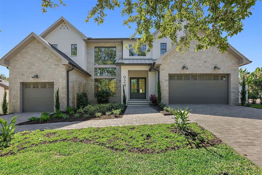 Under contract-accepting backup offers. Ready For Move-In (Non-Flood Zone and Non-Evacuation Zone)! Explore your newly constructed luxury home in the highly coveted Allendale neighborhood. Designed by luxury builder JBrowning Designs, this exquisite home features solid block construction (first and second floors) and is situated over 35 feet above sea level, ensuring unmatched durability and peace of mind across 4,268 air conditioned square feet. 

Upon entering through the grand double doors at 924 42nd Ave, you’ll discover a gourmet chef’s kitchen, five elegantly designed bedrooms, and four full bathrooms. The first-floor owner’s suite is an exceptional highlight, offering dual walk-in closets and an ensuite bathroom with a walk-in shower, soaking tub, and dual vanities for a spa-like retreat. A versatile additional bedroom on the first floor serves perfectly for family, guests, multi-generational living, or as a convenient home office with direct access to main living areas and outdoor spaces.

Custom woodwork, vaulted ceilings, and luxurious European oak flooring enhance the home's distinctive character. The expansive kitchen is a chef’s dream, featuring a walk-in pantry, a large island, and premium Thermador appliances, including a full-size wine refrigerator.

Step outside to enjoy the luxury of a heated pool with a spillover spa, situated within an expansive outdoor living area perfect for relaxation and entertaining. A covered lanai extends your enjoyment year-round, featuring a built-in BBQ grill and a poolside half bath.

Inside, ascend the stunning staircase to the second floor, where you’ll find three additional bedrooms, two full bathrooms, and a versatile flex space for use as a living room or study area. Conveniently, laundry rooms are located on both levels.

This luxury home is prewired for a smart home system, ready for Lutron lighting, wireless shades, audio systems, security cameras, and a full house generator. Safety and efficiency are prioritized with impact-rated ES windows and doors, a designer shingle roof with a metal entry, and state-of-the-art Trane HVAC systems. Experience energy efficiency with Rinnai tankless water heaters and spray foam insulation.

A spacious 3-car garage with 11-foot ceilings and high-lift doors accommodates your lifestyle needs. This extraordinary residence offers an unparalleled blend of luxury, comfort, and modern technology in the prestigious, tree-lined Allendale neighborhood. 20 Minutes to Tampa International Airport, 20 minutes to Award Winning Beaches, 7 minutes to waterfront downtown St. Petersburg.