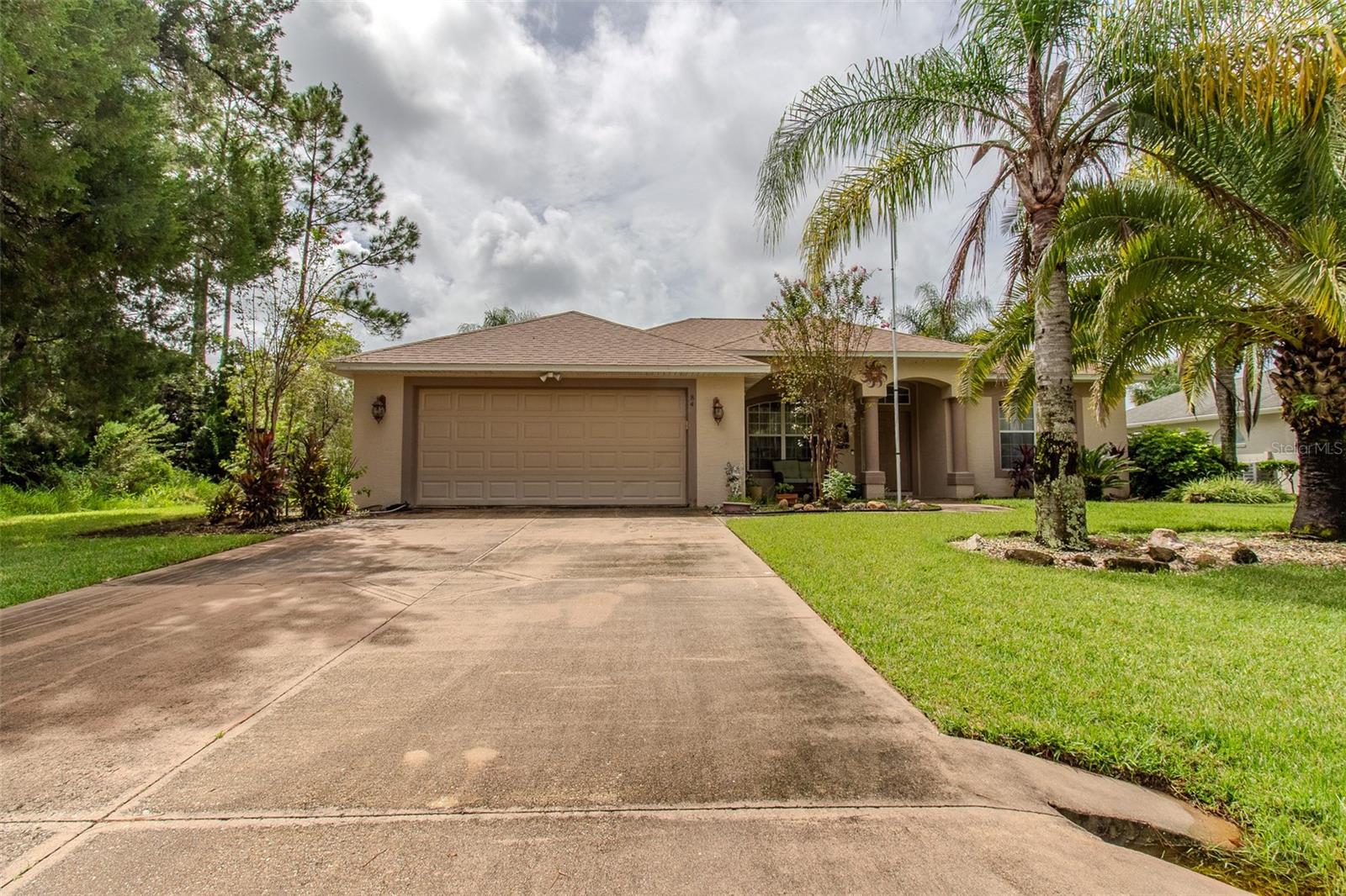 Welcome to this beautiful 3-bedroom pool home with an additional flex room, perfectly situated in the desirable Lehigh Woods neighborhood. From the moment you enter, you’ll be greeted by a spacious dining room and a large great room with three sliders that open to the screened-in lanai and sparkling pool, offering a stunning view as you walk in. The kitchen is designed for both style and function, featuring rich dark wood cabinets with frosted glass accents, granite countertops, stainless steel appliances, and a cozy breakfast nook that overlooks the pool area. All three bedrooms are finished with luxury vinyl plank flooring, and the versatile flex room provides the perfect space for a home office, den, or guest room. The outdoor living space is truly a highlight, with a covered patio, paver decking, and a large pool with plenty of room for seating, dining, or simply relaxing in the Florida sun. The fully fenced backyard is beautifully landscaped with palm trees, creating a private tropical retreat. A welcoming front porch adds to the curb appeal, while a new roof (2021) ensures peace of mind. Centrally located near shopping, restaurants, and schools, this home offers the perfect blend of comfort, convenience, and Florida lifestyle living.