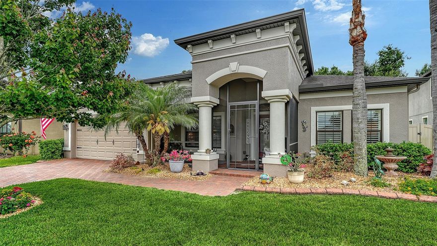 Beautiful, bright and immaculate!  This 3 bedroom 2 and a half bath pool home with a den has a 3 car tandem garage and fenced yard, and has been loved and impeccably maintained. The kitchen has wood cabinetry, granite countertops, stainless appliances, cooktop, double ovens, and a huge island. Plenty of storage and working space along with abundant space in the pantry. The covered and screened lanai overlooks the beautiful heated saltwater pool and fenced yard. Very private and peaceful. The spacious primary bedroom offers 2 walk-in closets, and the bathroom has double sink vanity, garden tub, and walk-in shower. The den/office has double glass doors,  built in cabinetry and granite with 2 work stations. Large laundry room with utility sink and room for a full size 2nd refrigerator.  This home offers long term energy savings with solar panels that provide monthly electric bills under $50.00 a month. The colorful landscaping is framed with curbing to keep the yard neat and orderly. The tandem garage offers room for 3 cars, a workbench area, or even a boat. This home has plantation shutters, tastefully upgraded fixtures, lighting, and fans. New A/C and microwave in 2025. The irrigation system uses water from the community lake and is included in the LOW HOA Fee.  NO CDD Fee.
