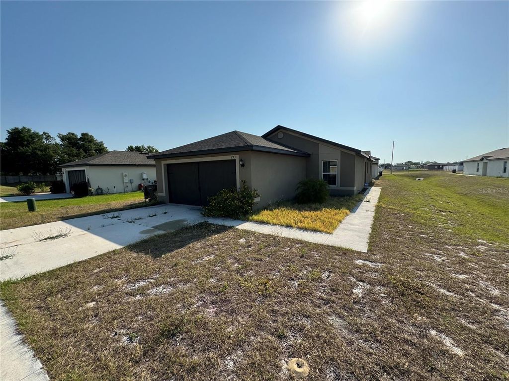Photo of 233 Kensington View Boulevard, Winter Haven, FL 33880 (MLS # O6395994)