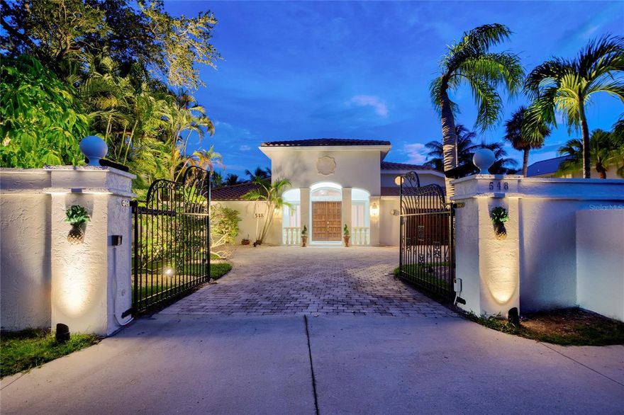 PRICE IMPROVEMENT! Step through the grand, gated entrance of 548 Siesta Drive and be greeted by a luxurious waterfront estate on Florida's breathtaking Siesta Key. This 4399 square foot waterfront haven exudes elegance from the very curb. As you pass through the wrought iron gate the home stands proudly on this .38 acre property amidst lush tropical landscaping and a custom brick paver driveway that can accommodate multiple cars.
Step inside through the solid double doors to the dazzling grand foyer with gleaming porcelain tile floors sets the stage, plantation shutters filtering in warm sunlight. Coffered ceilings soar overhead, adorned with elegant chandeliers and recessed lighting that bathes the space in a warm glow. Fourteen-foot-high ceilings are further emphasized by grand columns that line the entryway and flow into the formal dining area.
The back wall of the living area is a masterpiece of light and openness. Andersen sliding glass doors stretch from end to end, revealing a breathtaking vista of the pool, entertainment space, and the shimmering waterway beyond. Imagine hosting unforgettable gatherings for your family and friends.
Providing ample space guests, the home features three comfortable bedrooms, each with a luxurious touch and feel. An additional loft space offers versatility, perfect for a home office, media room, or extra sleeping quarters. The 3.5 bathrooms are tastefully designed with beautiful bright cabinetry, lighting and gold fixtures.
The heart of the home is a bright kitchen, boasting ample storage in stylish Shaker-style cabinetry. A center island with granite countertop and vegetable sink provides the perfect spot for meal prep, while expansive windows ensure every seat at the breakfast table enjoys the stunning lanai, pool and water views.
The luxurious feel extends to the private quarters. Large bedrooms offer spacious en suite baths, custom closets, high ceilings adorned with crown molding, and morning porch for relaxing creating a sense of spacious comfort. The elegant primary bathroom is a spa-like retreat, featuring multiple vanities, a dedicated makeup vanity, gold fixtures, soaking tub with separate shower, water closet, and gleaming porcelain tile flooring. The garage/man cave is a luxury car owners dream featuring marble floors, cabinetry, air conditioning and flat screen television.
But the true star of the show unfolds behind the house. Imagine a sparkling oasis – a gorgeous open pool surrounded by swaying palm trees, a paver deck and a privacy wall, creating a secluded haven for relaxation. The 108 linear foot water frontage includes a double-dock with two boat lifts. The canal ends in a cul-de-sac at this point so you can enjoy access to the Gulf but not a lot of boat traffic behind your home.
7 Day Min Rental! This isn't just a house; it's a luxurious waterfront sanctuary designed for grand living and unforgettable memories. From the tropical landscaping and inviting pool to the expansive living areas and opulent bathrooms, this home promises an unparalleled Siesta Key experience. Siesta Key itself is a paradise, renowned for its sugar-whit sand beach, consistently rated among the nation's finest. Beyond the beach, Siesta Village pulsates with energy, offering a delightful mix of shops, restaurants, and nightlife. Immerse yourself in the natural beauty of the area's parks or explore the hidden coves accessible by kayak or boat. Siesta Key truly delivers an idyllic Florida lifestyle.
