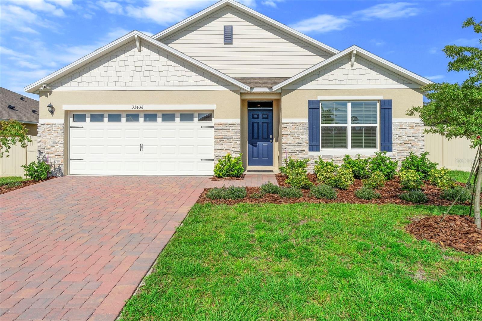 One or more photo(s) has been virtually staged. Better than new and beautifully enhanced—welcome to 33436 Shutterfly Way, a meticulously upgraded 4-bedroom, 2-bath home on a premium corner lot in the desirable Sorrento Pines community. Built in 2024, this nearly 1,900 sq ft residence combines modern style with functionality, offering over $50,000 in high-quality upgrades that elevate everyday living.
Step inside to find brand new flooring, fresh interior paint, and an open-concept layout filled with natural light. The split bedroom plan ensures privacy, while the spacious living area seamlessly flows into a thoughtfully upgraded kitchen featuring finished cabinetry around the refrigerator for a built-in look.
The laundry room is equally refined, complete with upper cabinets topped with crown molding and a quartz countertop—perfect for both utility and style. The primary suite is a peaceful retreat, offering an upgraded shower with a glass door enclosure , custom-framed mirrors, and upgraded lighting. The bedrooms are outfitted with plush new carpeting, premium padding, and ceiling fans for added comfort.
Standout upgrades include:
• Vinyl privacy fence
• Outside security camera system
• Whole-house water softening system
• Finished garage with indoor/outdoor carpet
• Custom cabinetry surrounding refrigerator
• Quartz countertop and upper cabinets with crown molding in laundry room
• Glass shower enclosure in primary bathroom
• Custom-framed mirrors and upgraded lighting
• Dining room chandelier, upgraded curtains, and ceiling fans throughout
• Wall-mounted TV in a secondary bedroom
Community & Location Perks:?
Located in scenic Lake County, Sorrento Pines offers sidewalks, a playground, and a relaxed neighborhood atmosphere. Enjoy close proximity to two premier golf courses—RedTail Golf Club, known for its championship design and scenic vistas, and Eagle Dunes Golf Club, offering rolling terrain and a welcoming golf experience.
Nature lovers will appreciate easy access to Rock Springs Run State Reserve, a 14,000-acre preserve with trails, horseback riding, canoeing, and natural springs. Just minutes from charming Mount Dora, shopping, dining, and major highways—and only a short drive to Orlando–Sanford International Airport—this location delivers both convenience and lifestyle.
Move-in ready and exceptionally well-appointed, this upgraded home offers comfort, style, and a prime location—schedule your private showing today!