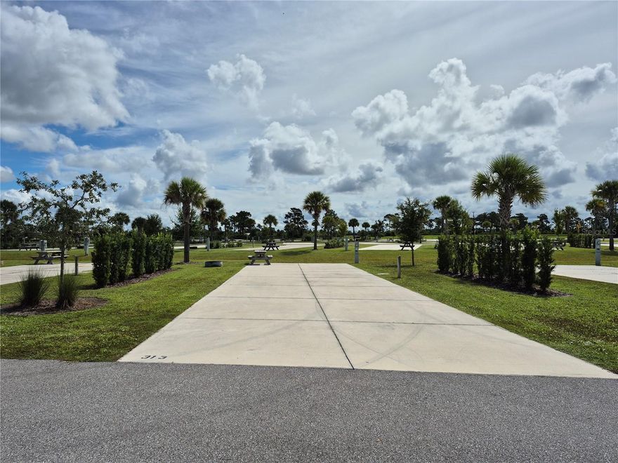 Welcome to the Resort at Canopy Oaks in Lake Wales, Florida! Surrounded by the beauty of natural Florida, this premier RV destination offers resort style amenities including a large pool and hot tub, a 12,000 sq. ft. clubhouse, full-service tiki bar, on-site café and general store, pickleball courts, shuffleboard, bocce, fishing ponds, dog parks, and picturesque walking trails. This deeded site provides a peaceful setting with plenty of space to unwind. The generous 20’ x 70’ concrete pad features full hookups (20/30/50 amp) and easily accommodates Class A, Class C, fifth wheels, travel trailers, or even a small park model—making it the perfect carefree seasonal retreat.